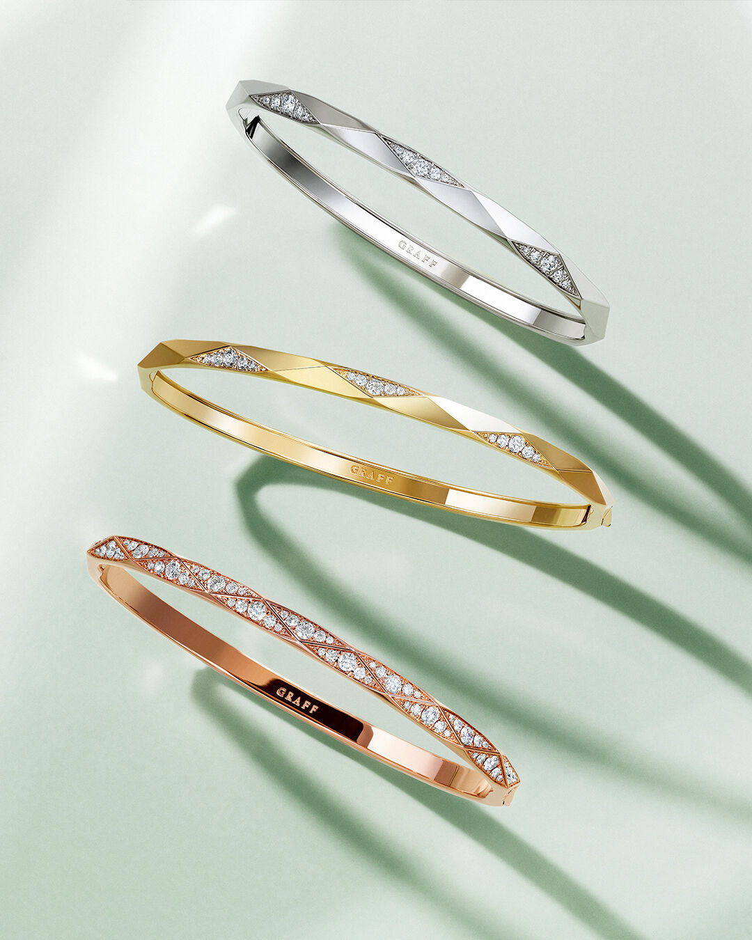 Image shows model wearing Laurence Graff Signature bangles and rings 