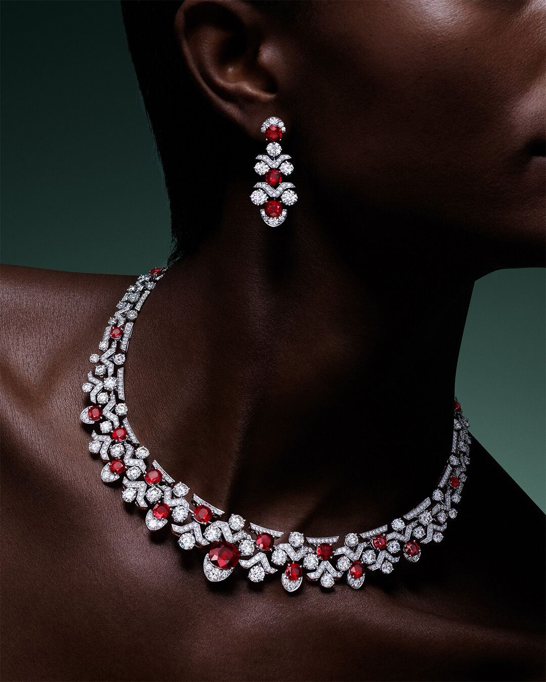 Image shows model wearing Graff Ruby High Jewellery necklace and earrings