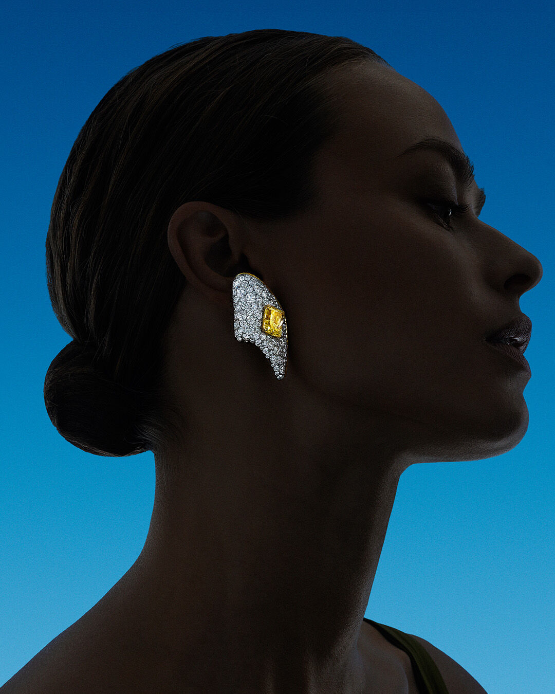 Image shows model wearing Graff Yellow and White Diamond High Jewellery earrings