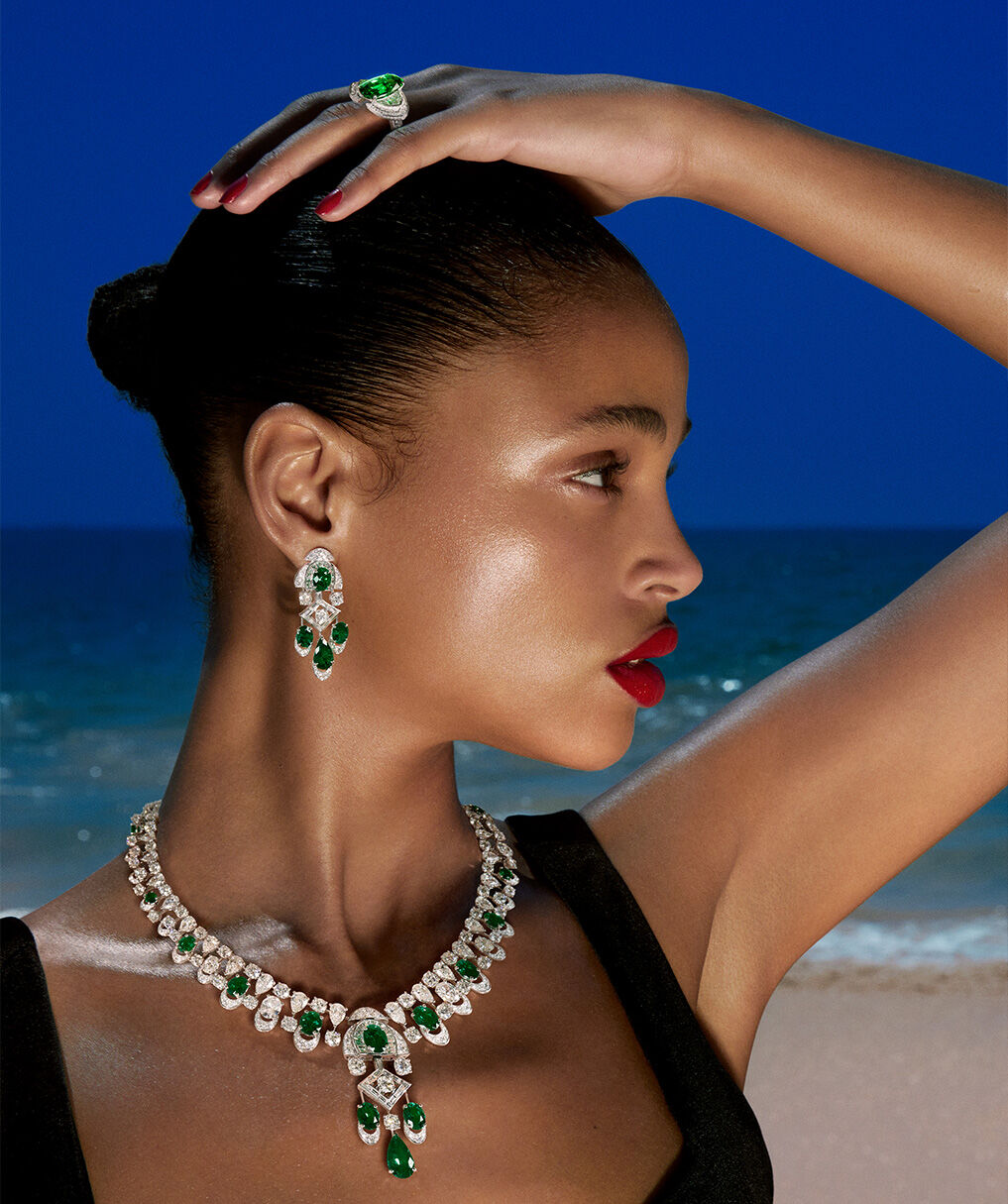 Modeal wears emerald and white diamond high jewellery suite