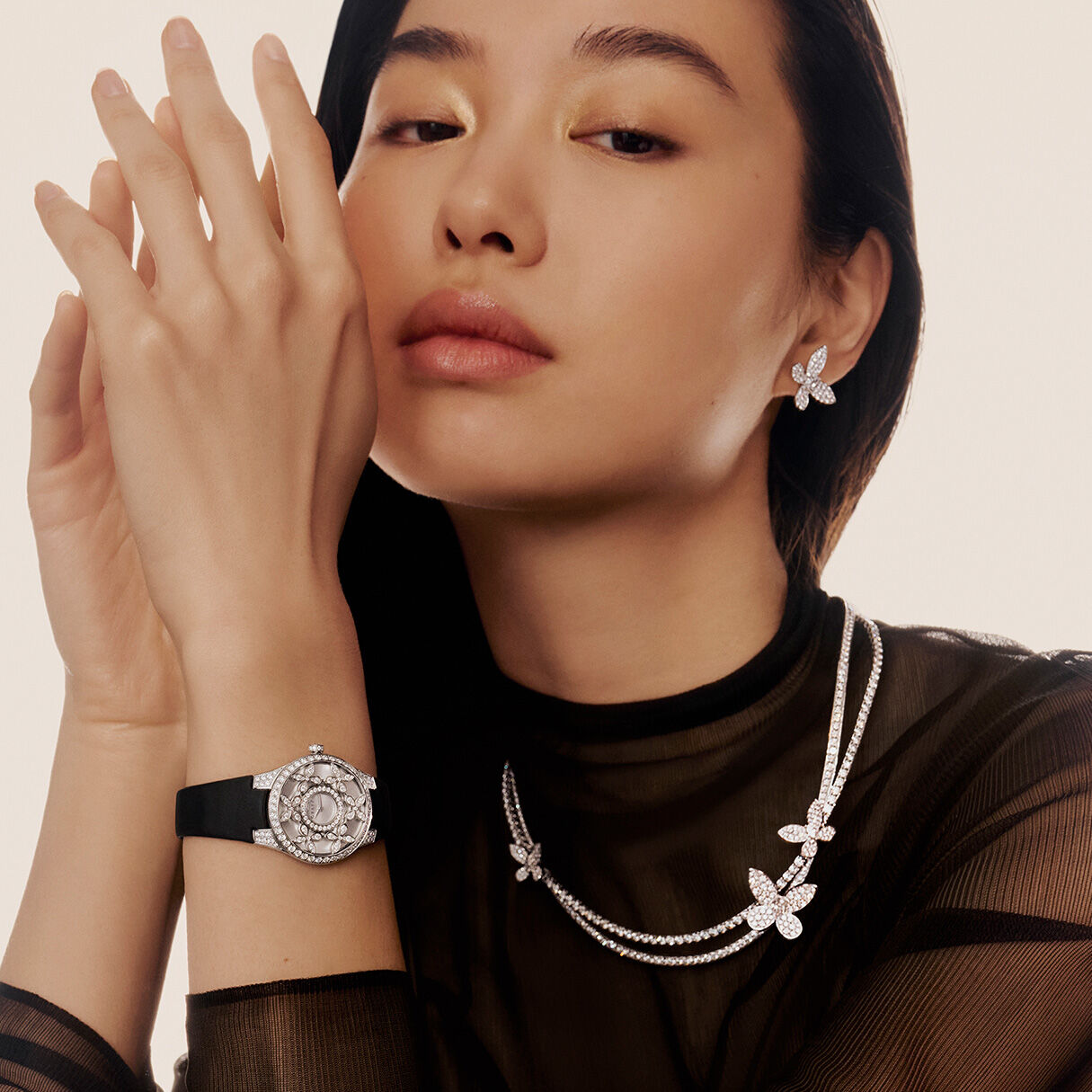 Model wears Graff Diamond Butterfly Collections Necklace, Watch and Earrings
