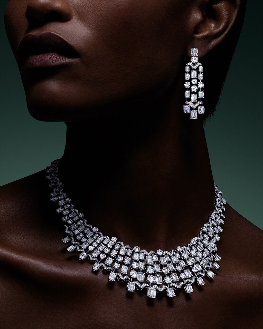 Image shows model wearing Graff White Diamond High Jewellery necklace and earrings