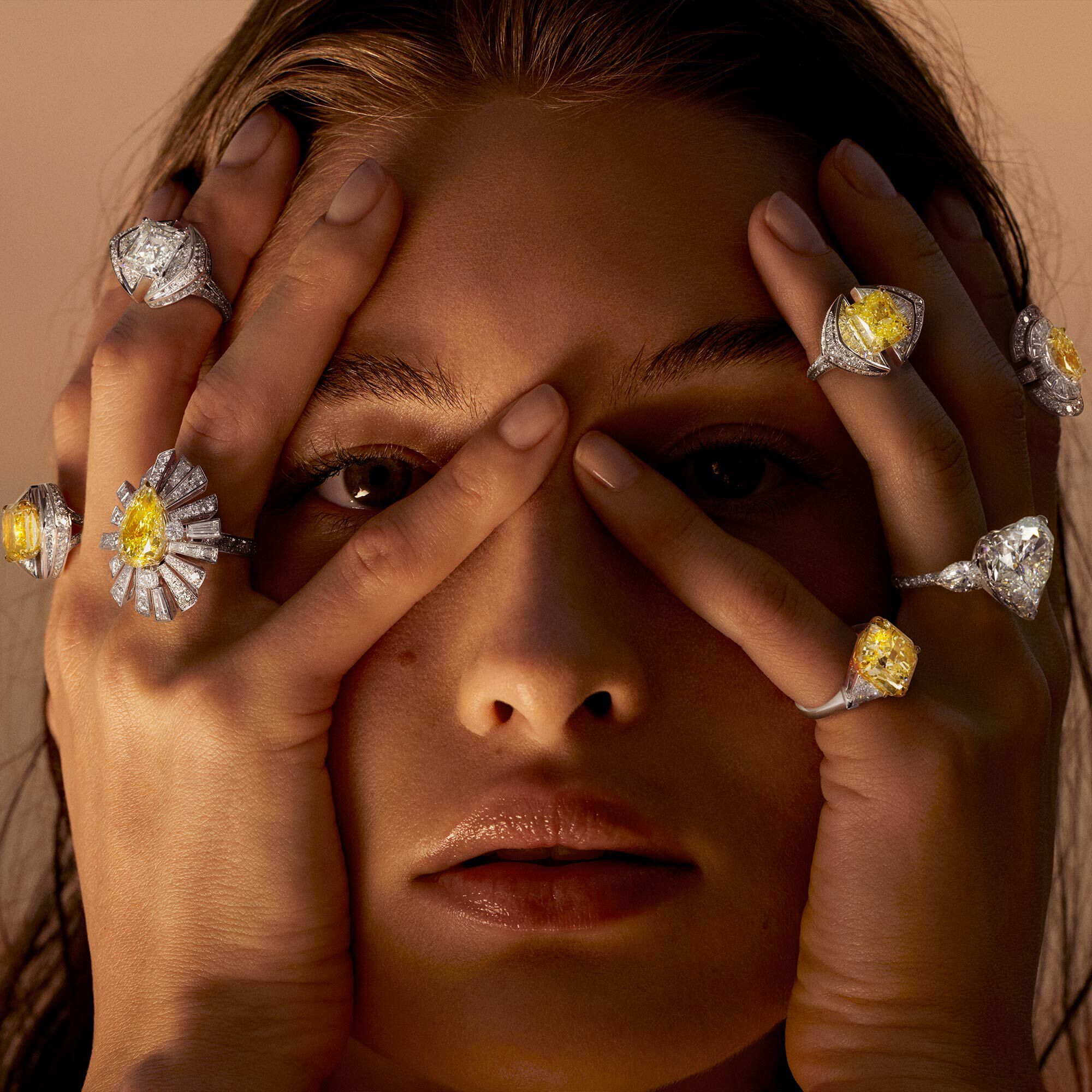 Model wears yellow and white diamond high jewellery rings