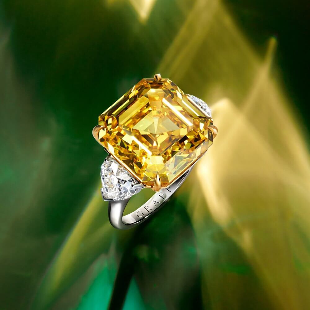 A Graff emerald cut yellow diamond ring