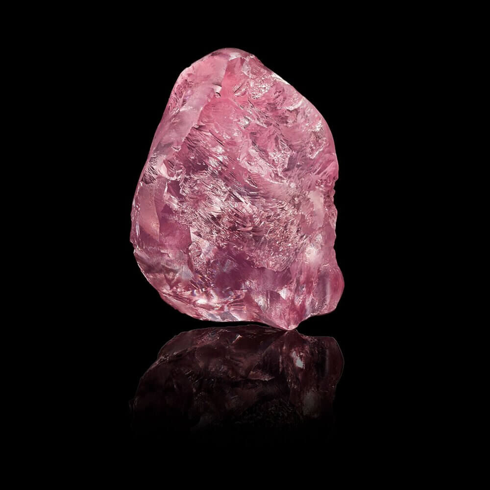 The Graff 13.33ct Lesotho Pink rough Diamond on a black background