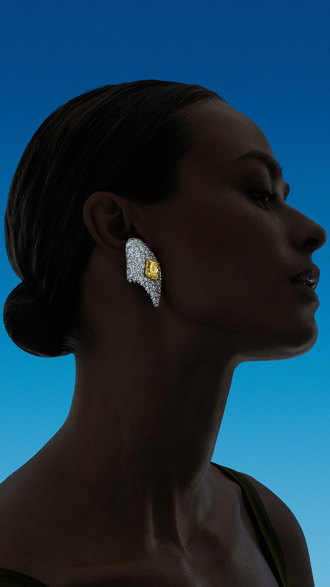 Image shows model wearing Graff Yellow and White Diamond High Jewellery earrings