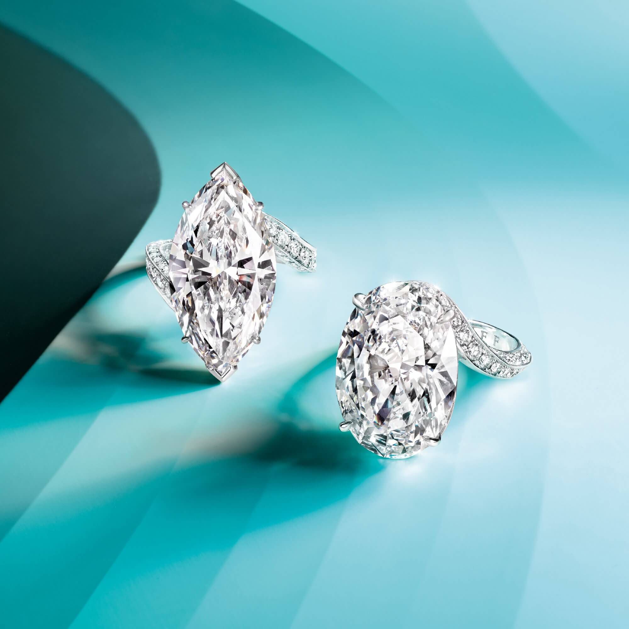 Two Graff diamond rings featuring a marquise shape diamond and an oval shape diamond respectively
