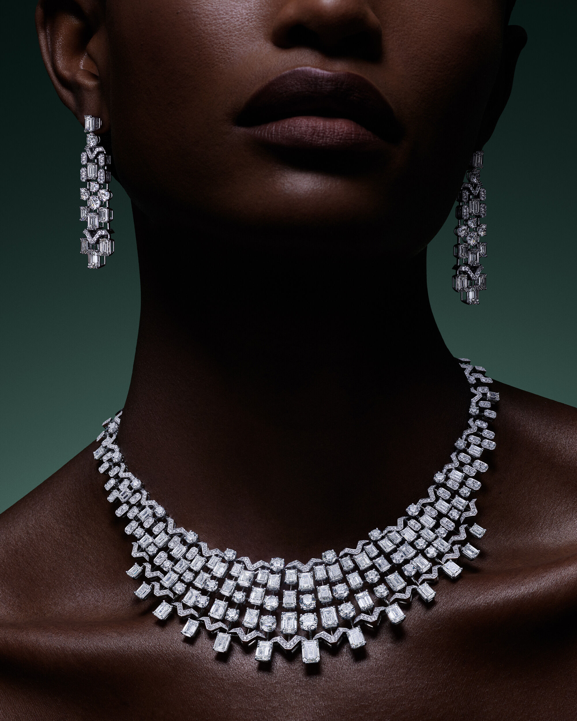 Image shows model wearing Graff Yellow Diamond High Jewellery earrings and necklace