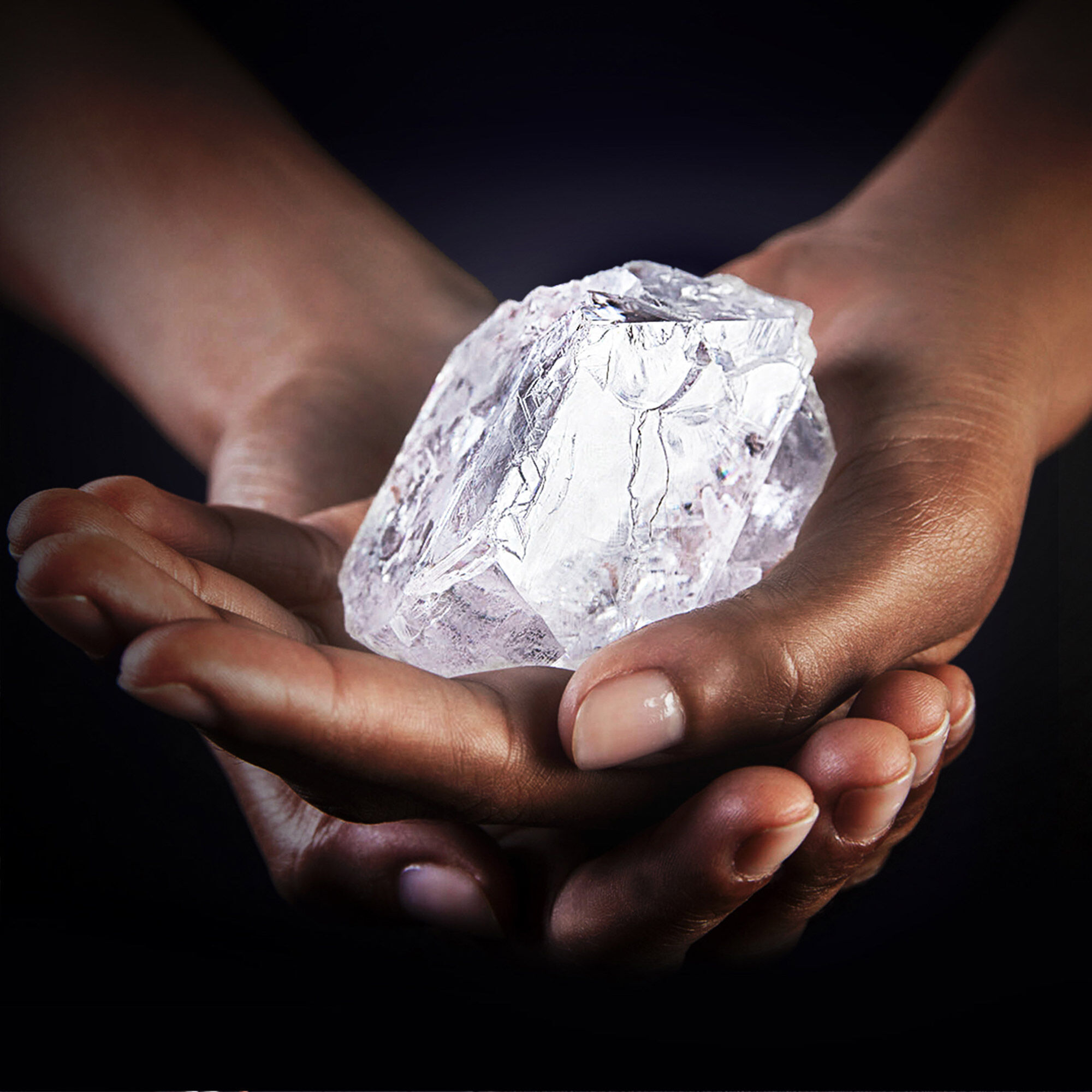 Close up of the Graff Lesedi La Rona rough stone in the hands of a model