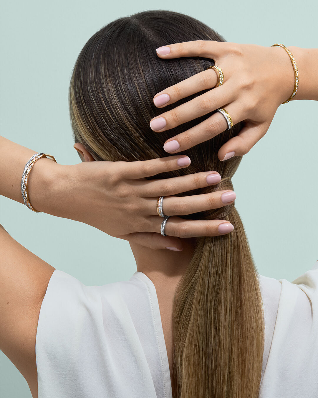 Laurence Graff Signature - image shows model wearing Laurence Graff Signature rings and bangles 