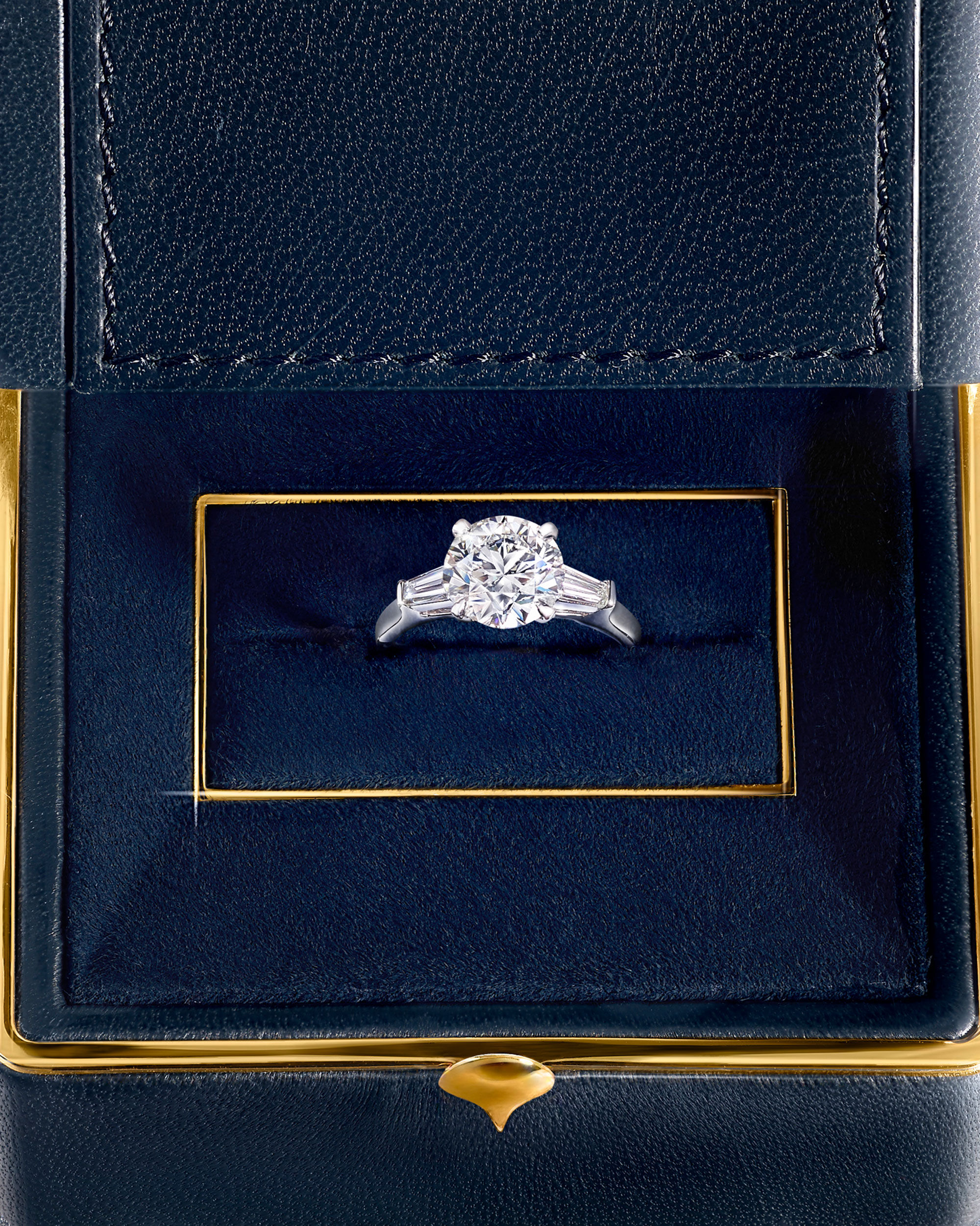 Close up of a Graff diamond engagement ring in a jewellery box