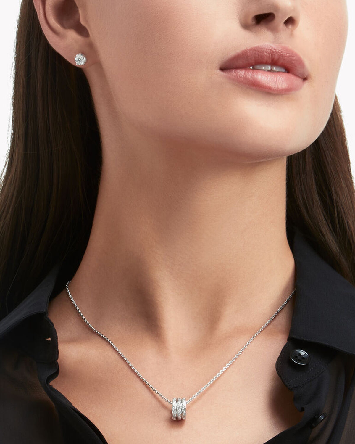 Close up of a model wears Laurence Graff Signature collection diamond jewellery