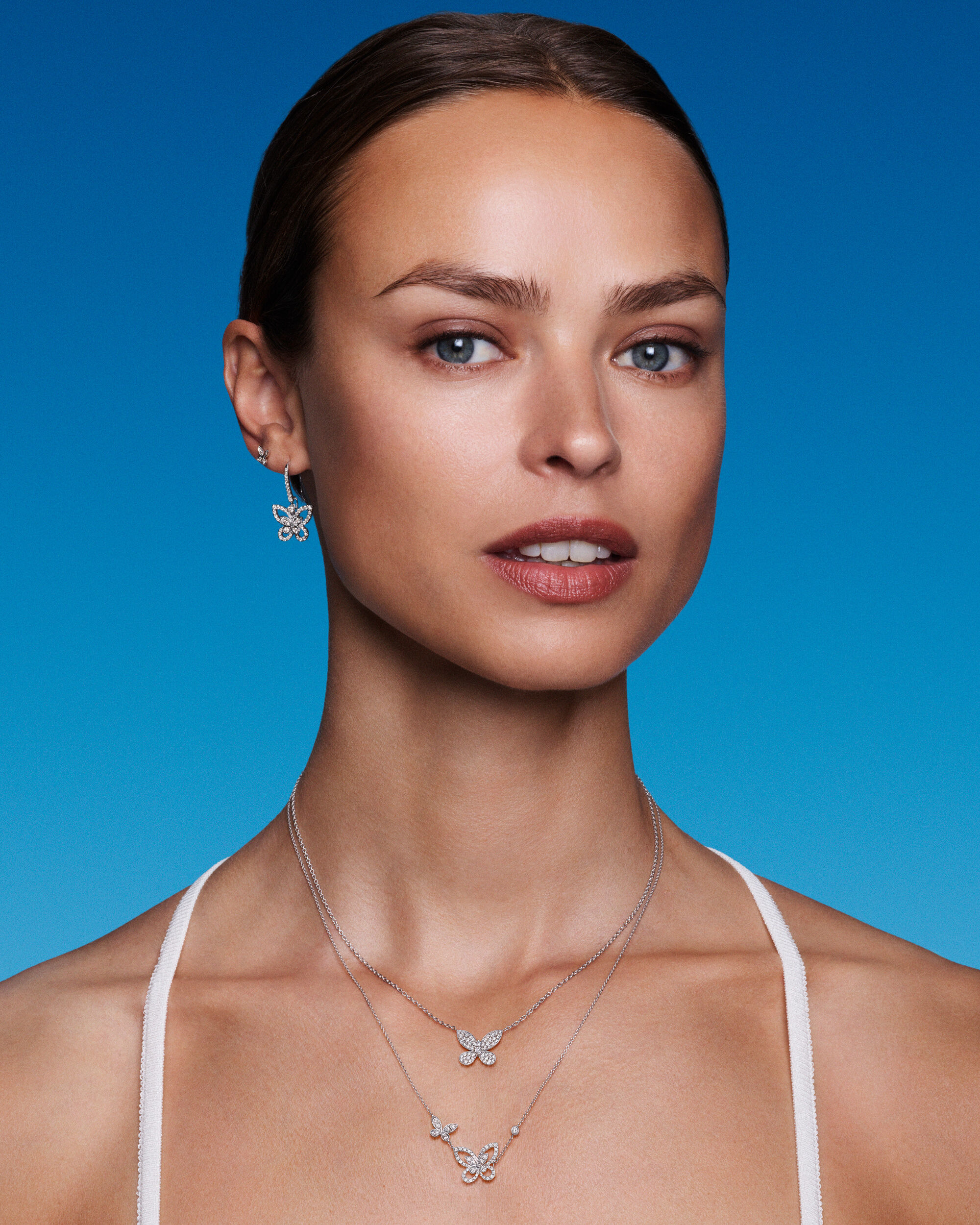 Image of model wearing Graff Butterfly diamond jewellery