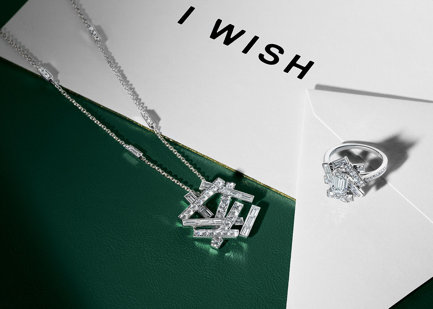 Gifts for her. still life image of Graff Tilda's Bow earrings and pendant 