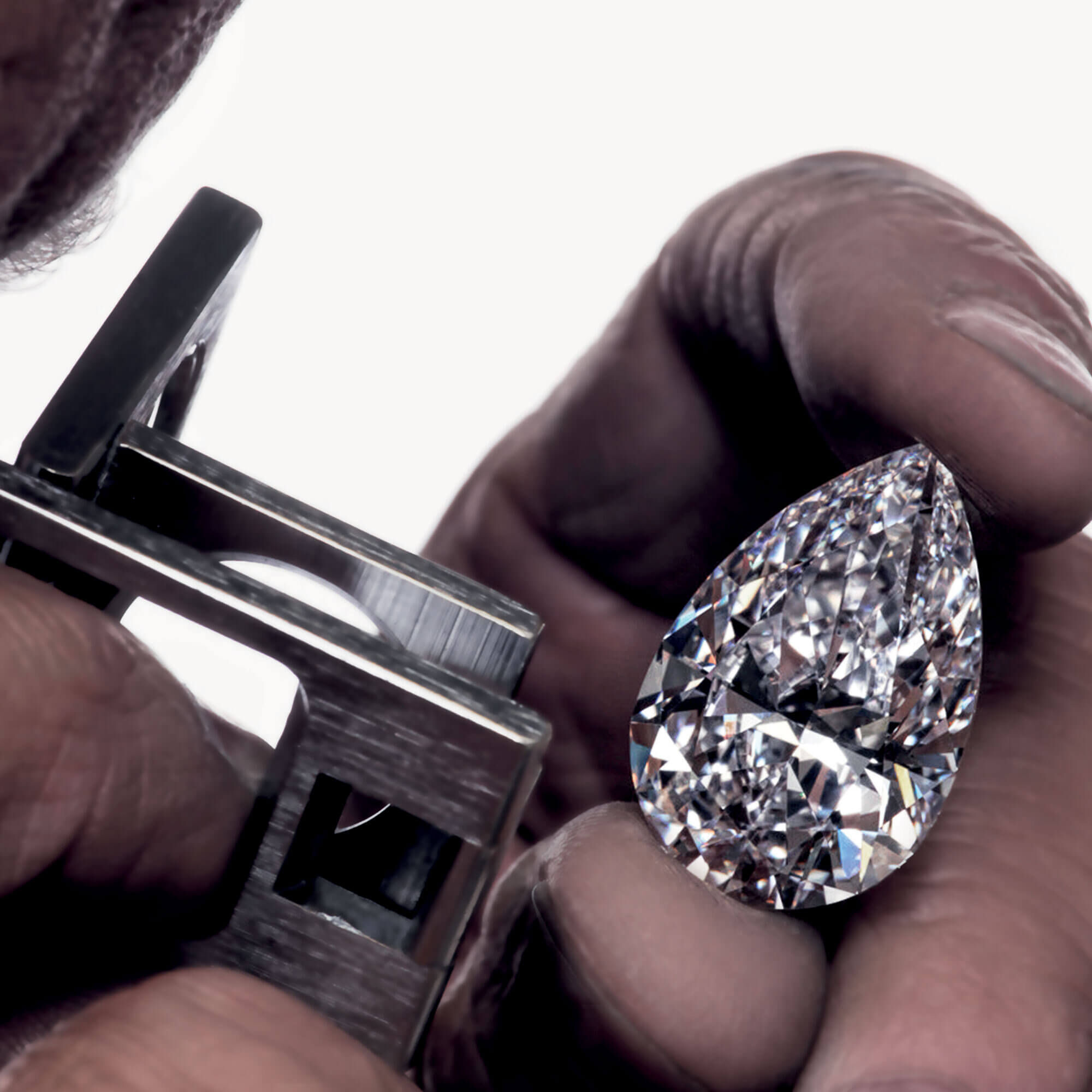 Close up of the Graff Vendôme pear shape diamond under examination