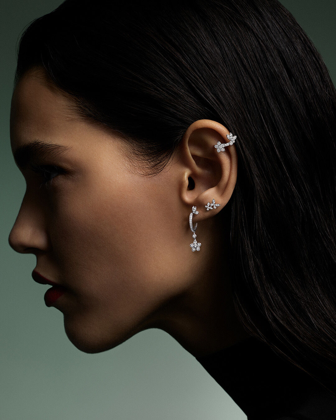 Image shows model wearing Graff Butterfly Earrings and Ear Cuff