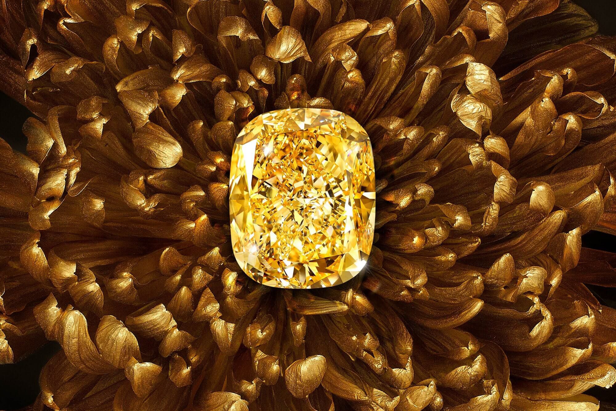 The famous Graff Golden Empress yellow diamond with a background of golden flower petals