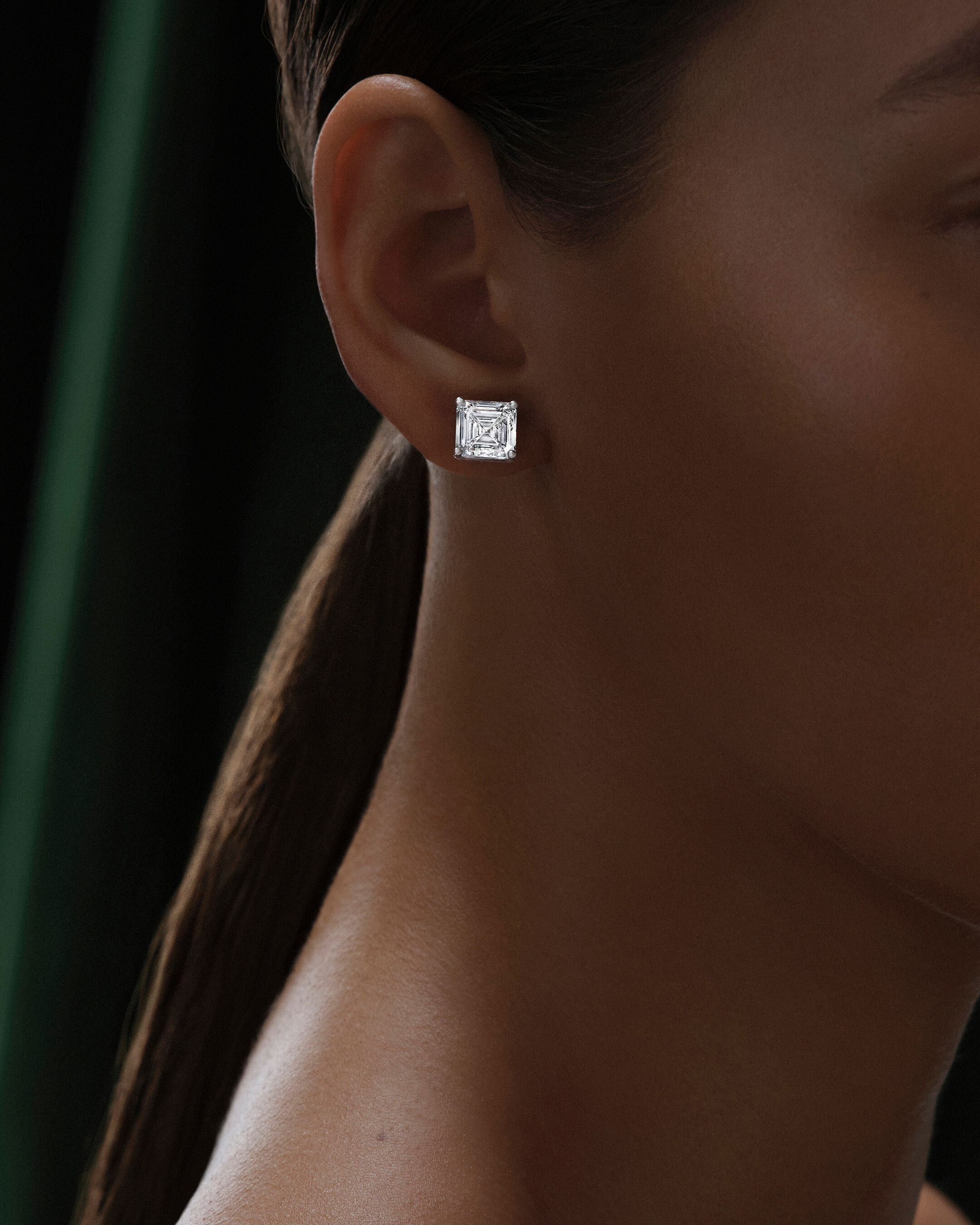 Image shows model wearing Laurence Graff Signature bangles and rings 