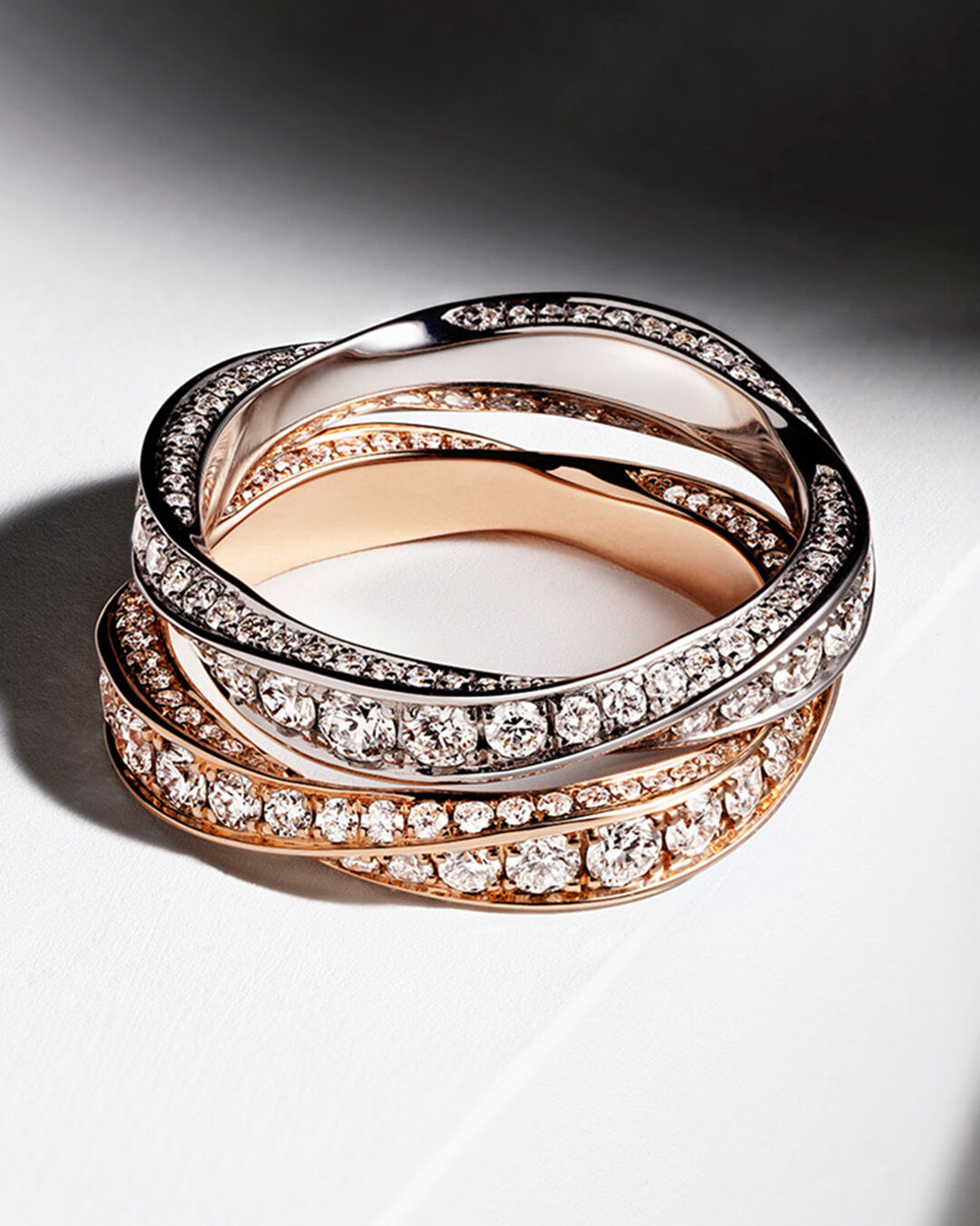 Laurence Graff Signature, image shows model hand wearing Laurence Graff Signature Rings and Bangles