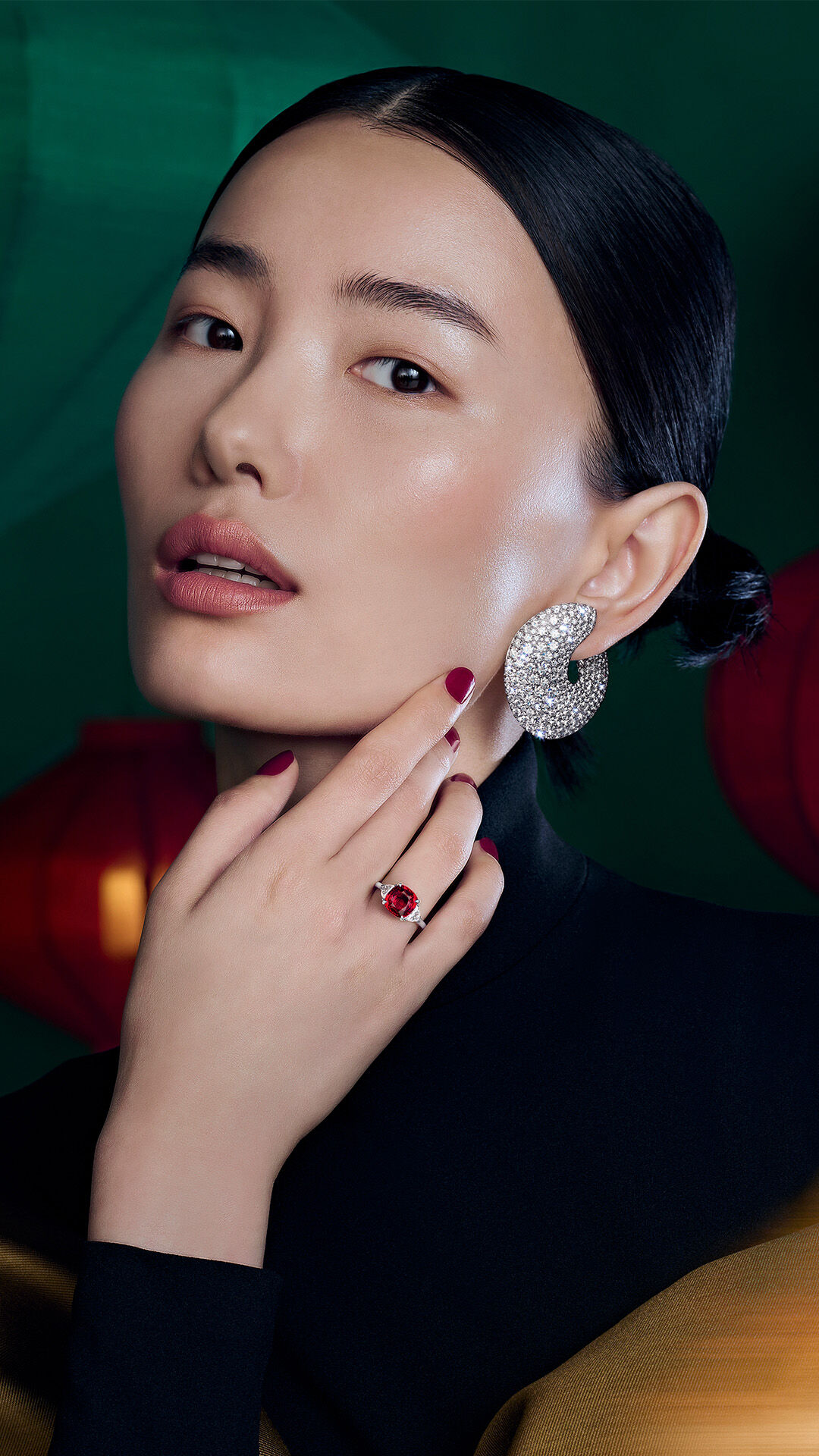 Image shows model wearing Graff oval diamond jewellery and icon oval engagement ring