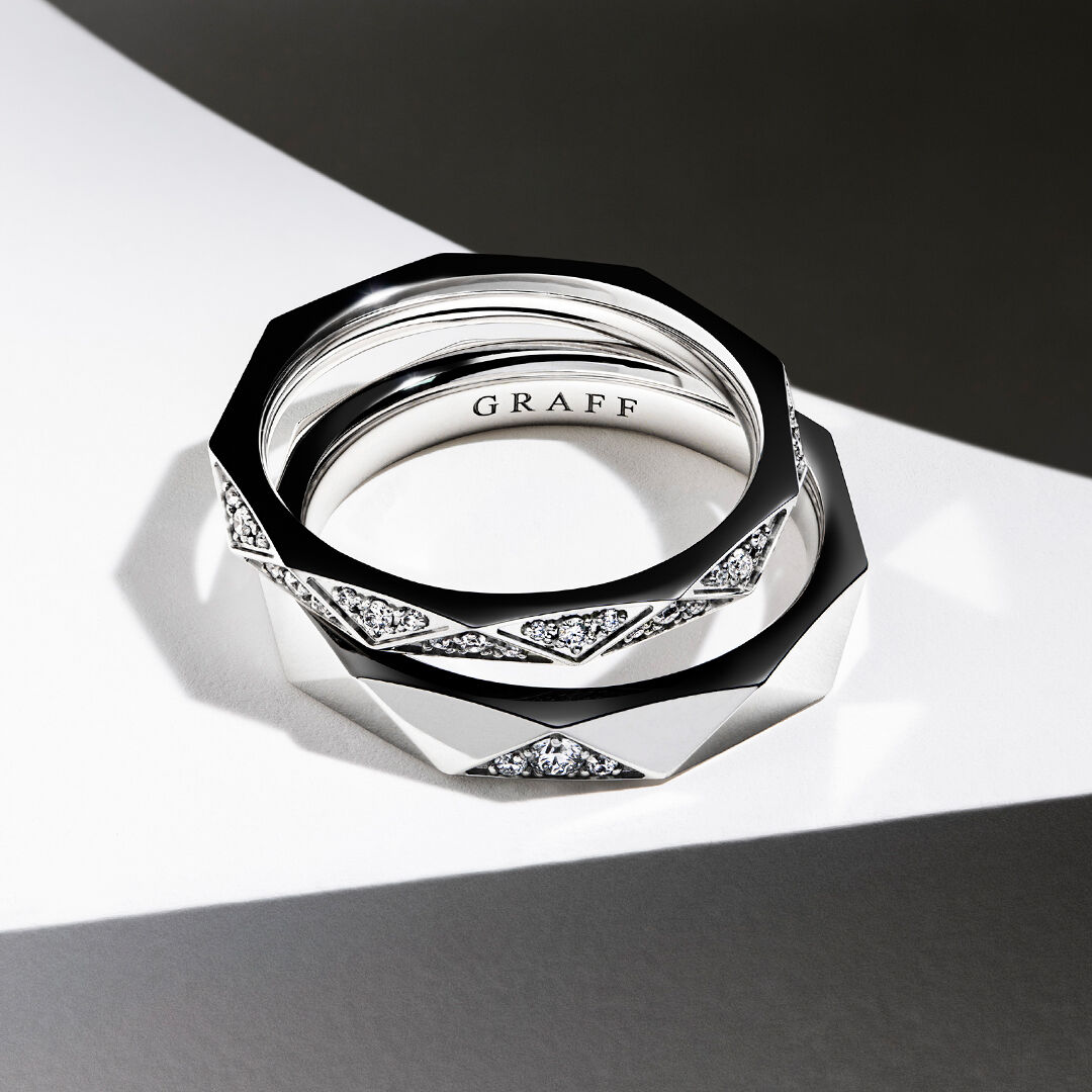 Models wearing Graff Engagement ring and Wedding bands
