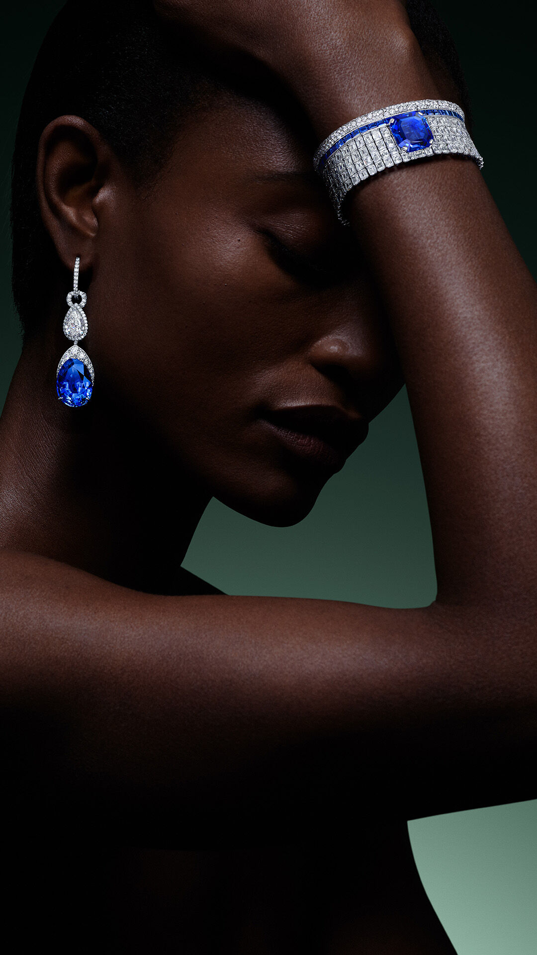 Sapphire High Jewellery - image shows model wearing Graff High Jewellery Sapphire and Diamonds earrings and bracelet 