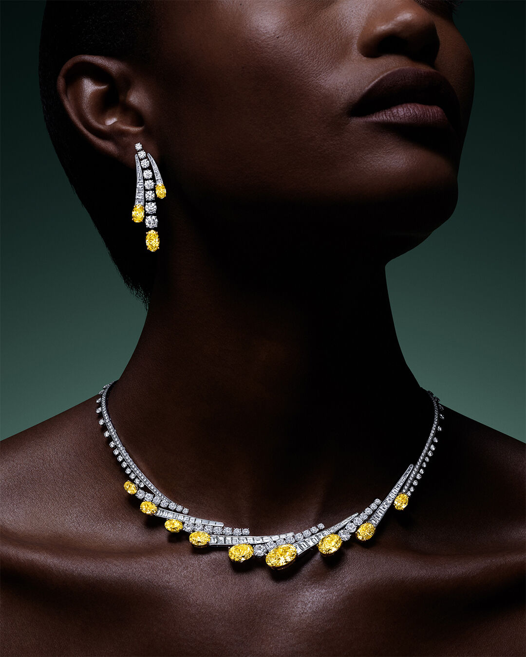 Image of model wearing Graff Galaxia Yellow Diamond Rings and Earrings