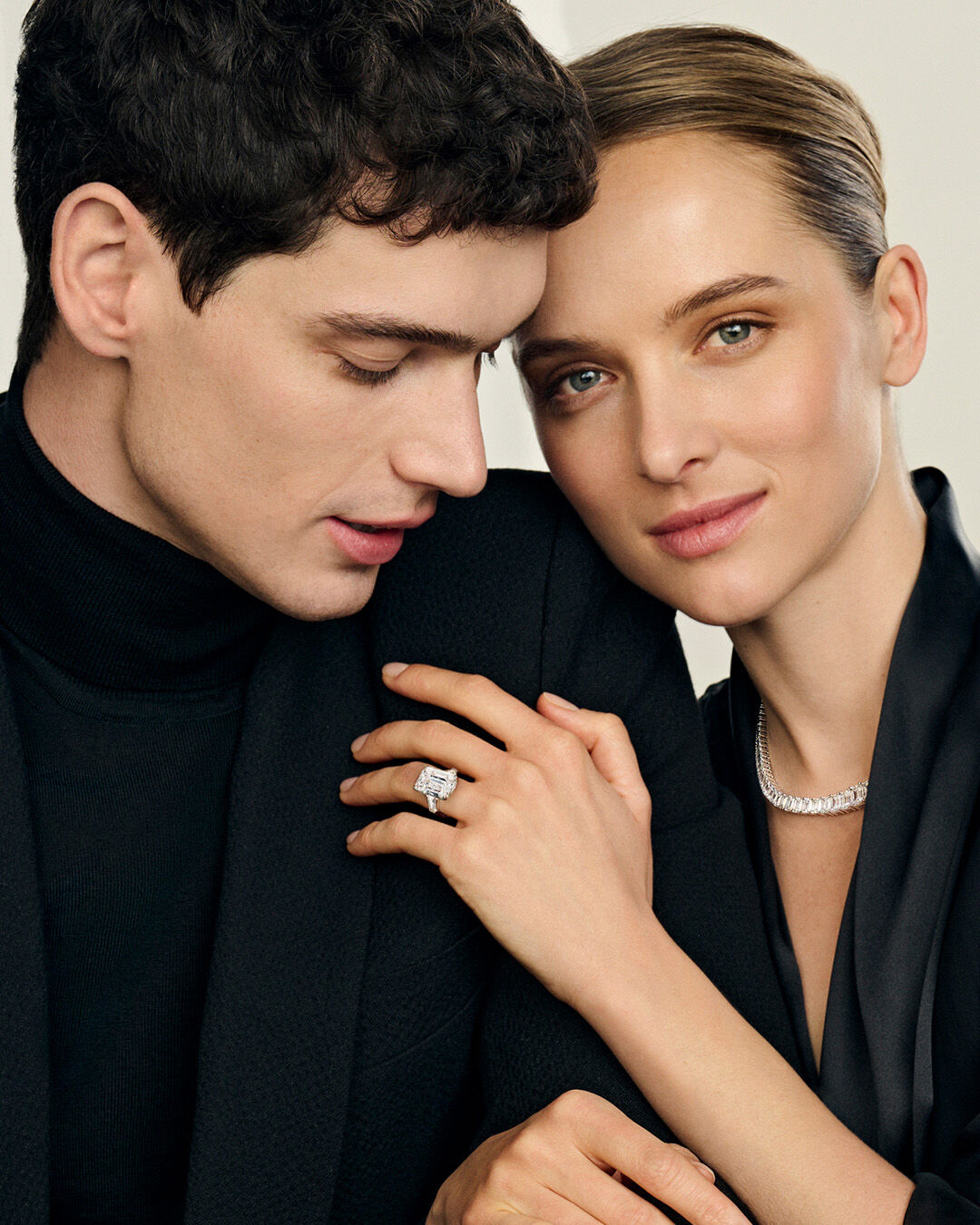 Image shows model wearing Graff heart shape line necklace, bracelet and heart shape engagement ring