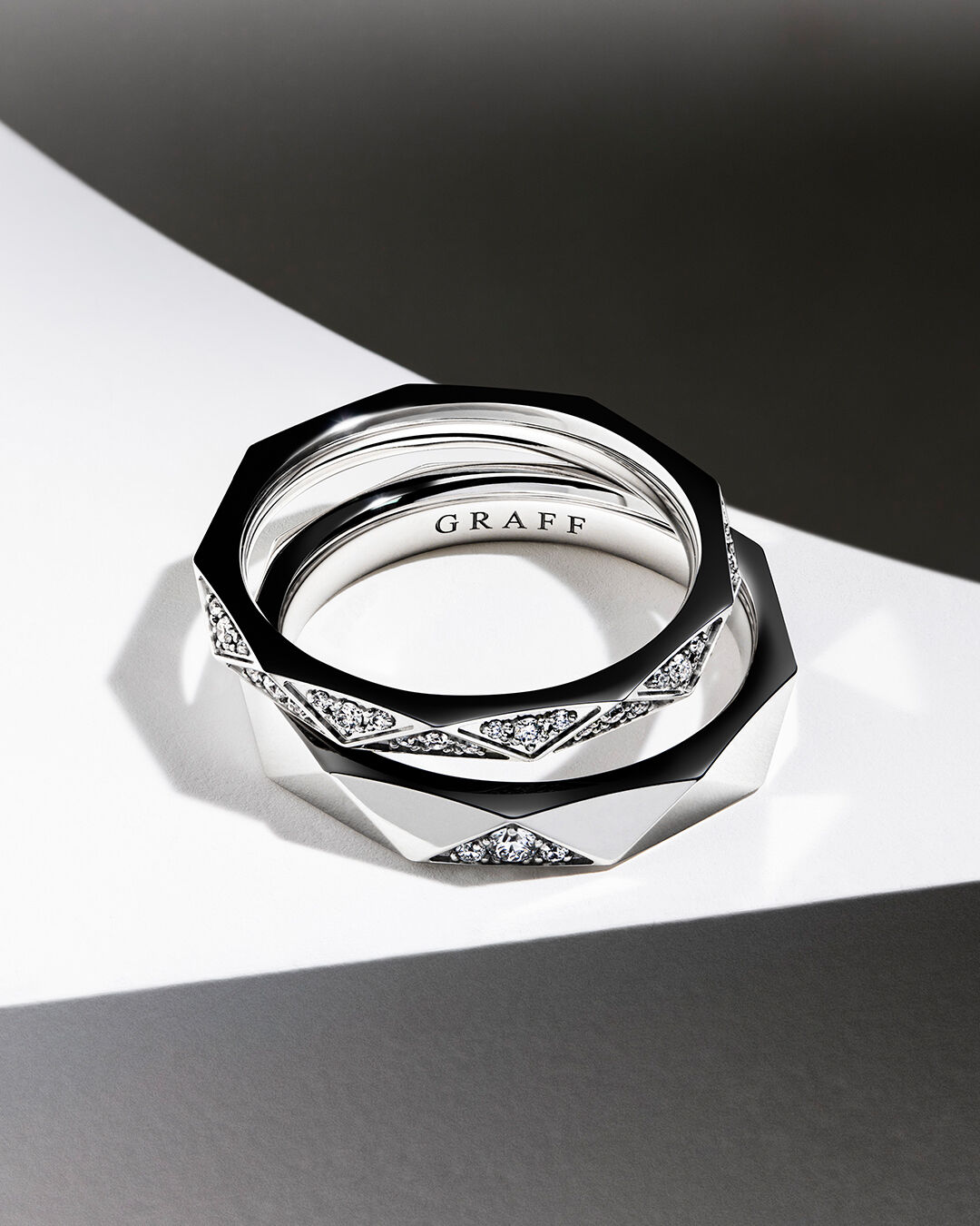 Laurence Graff Signature, image shows model hand wearing Laurence Graff Signature Rings and Bangles