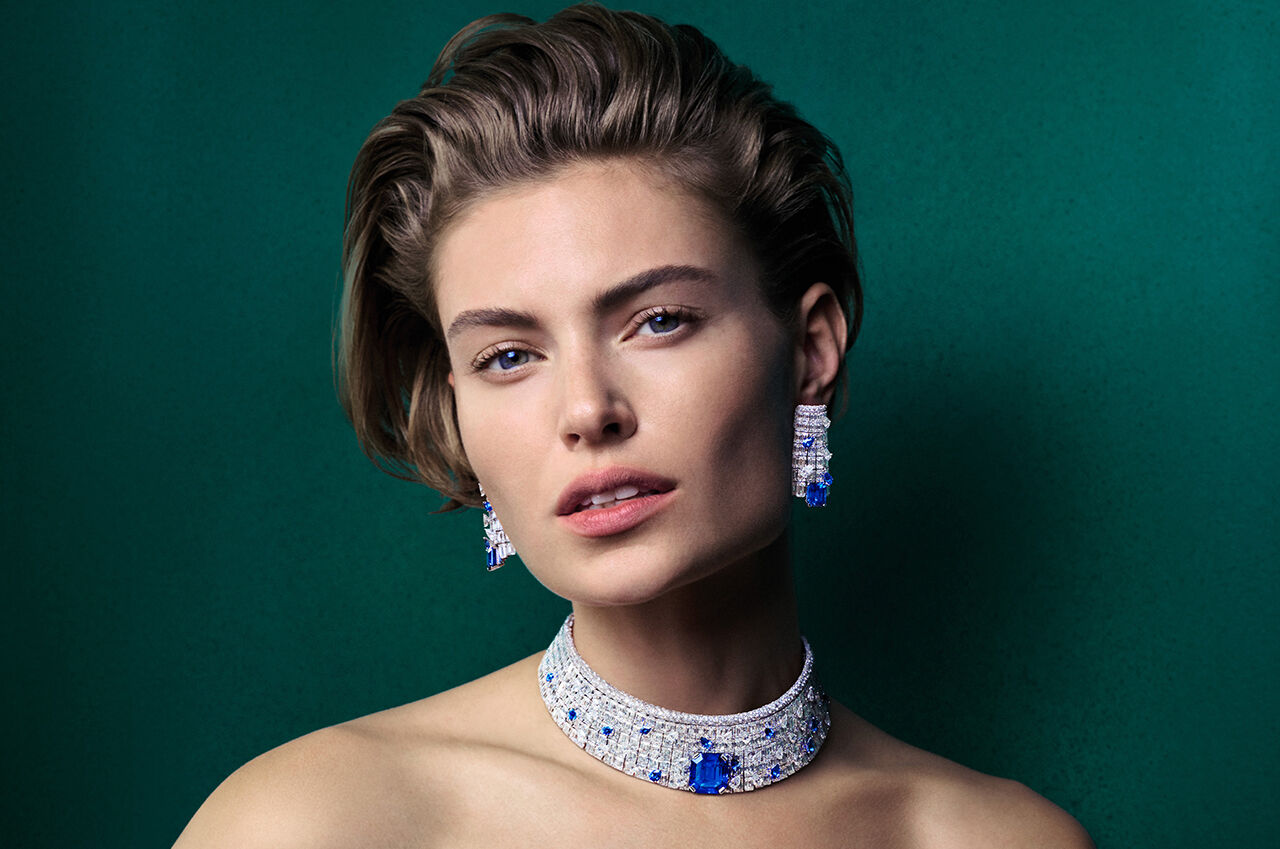 Image shows model wearing Graff Sapphire High Jewellery suite