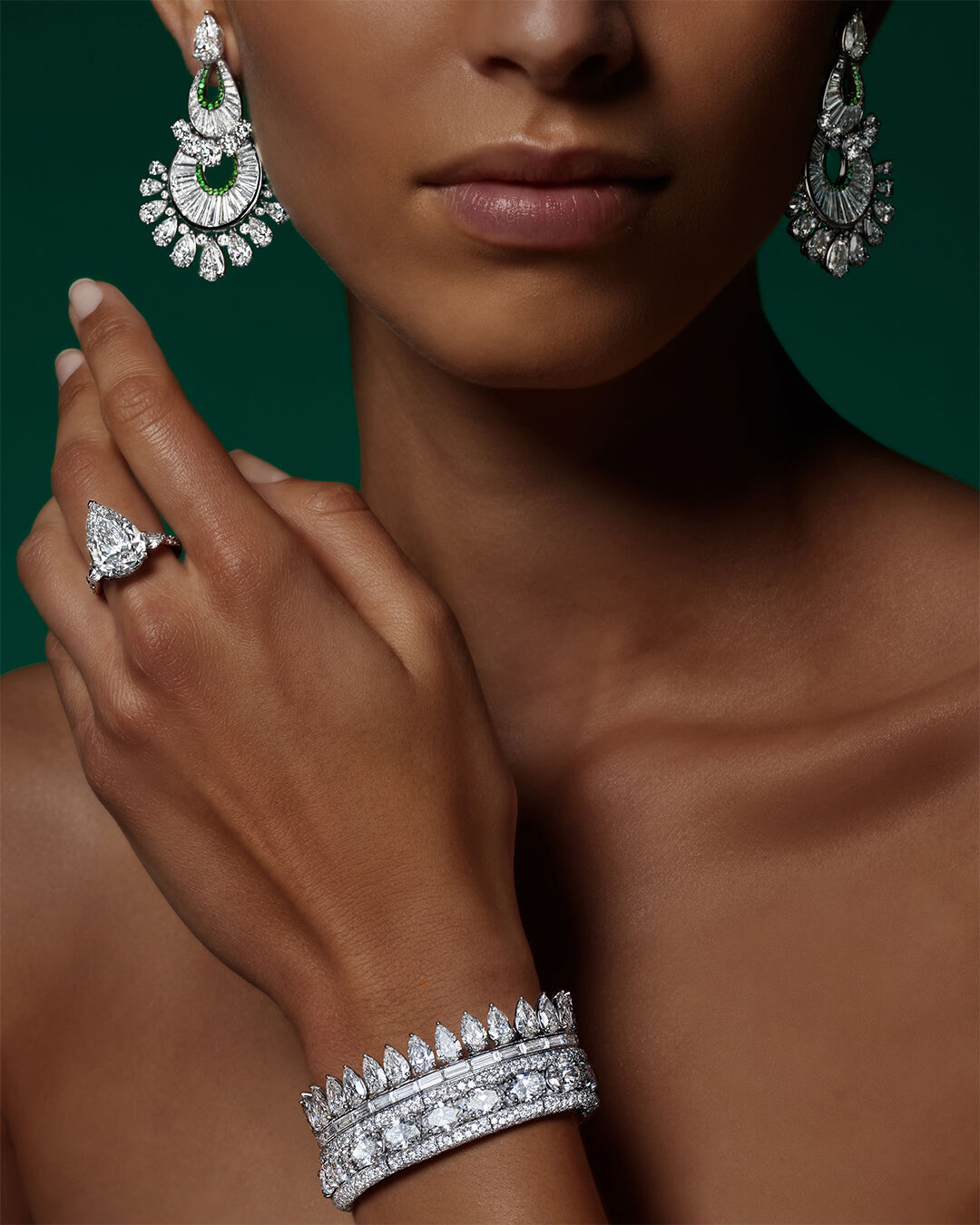 Image of model wearing Graff White Diamond High Jewellery Bangle, Ring and Earrings