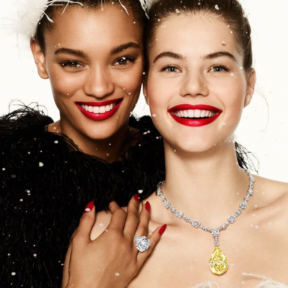 Two models wearing Graff yellow and white diamond high jewellery