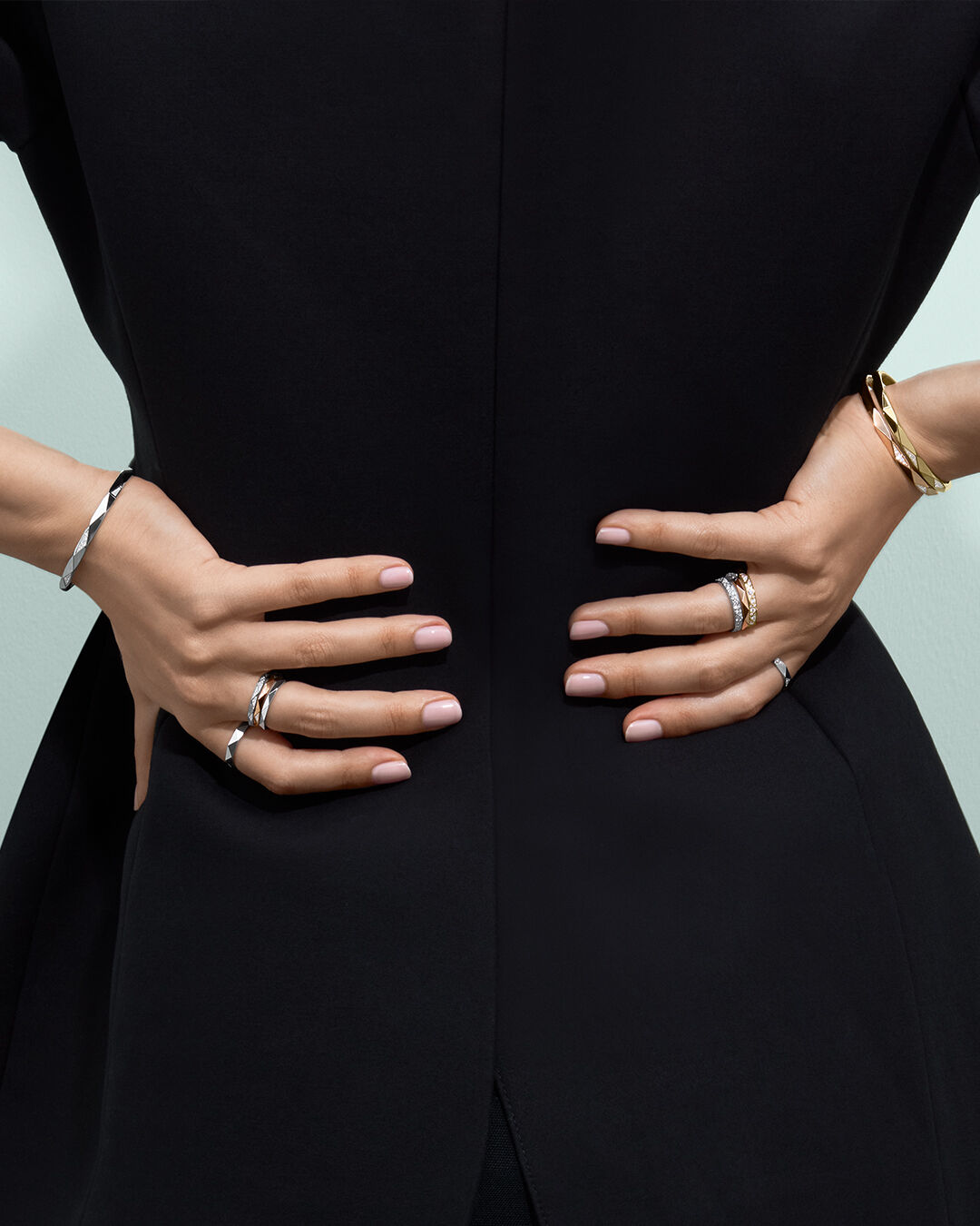 Image shows model wearing Laurence Graff Signature bangles and rings 