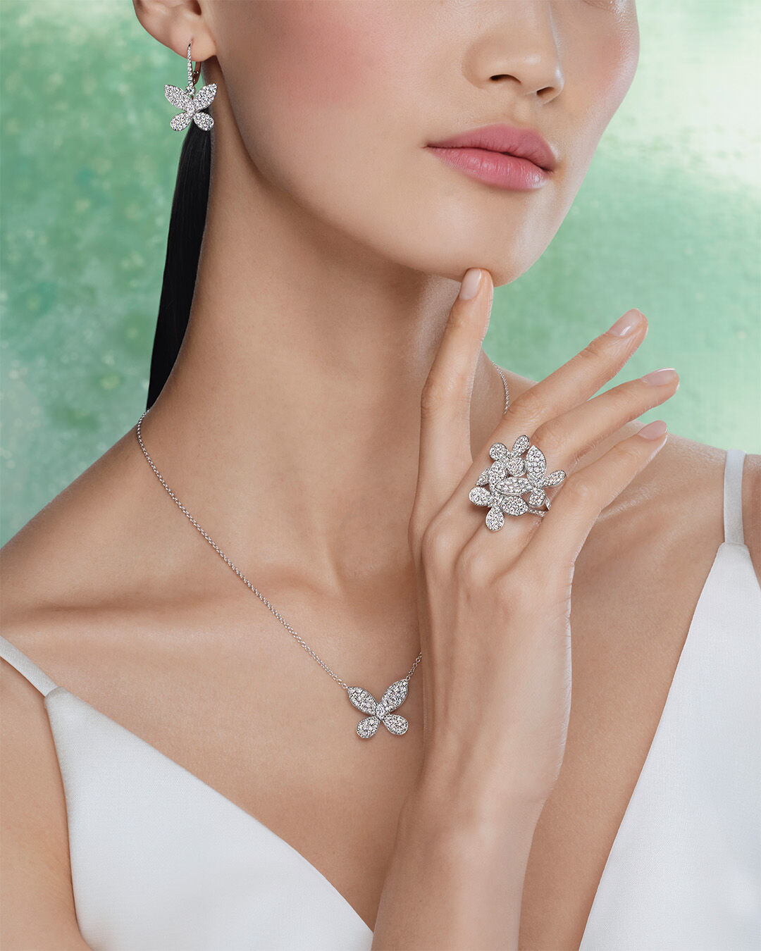 Matching Sets - image shows model wearing matching Graff Butterfly necklace, earrings and rings