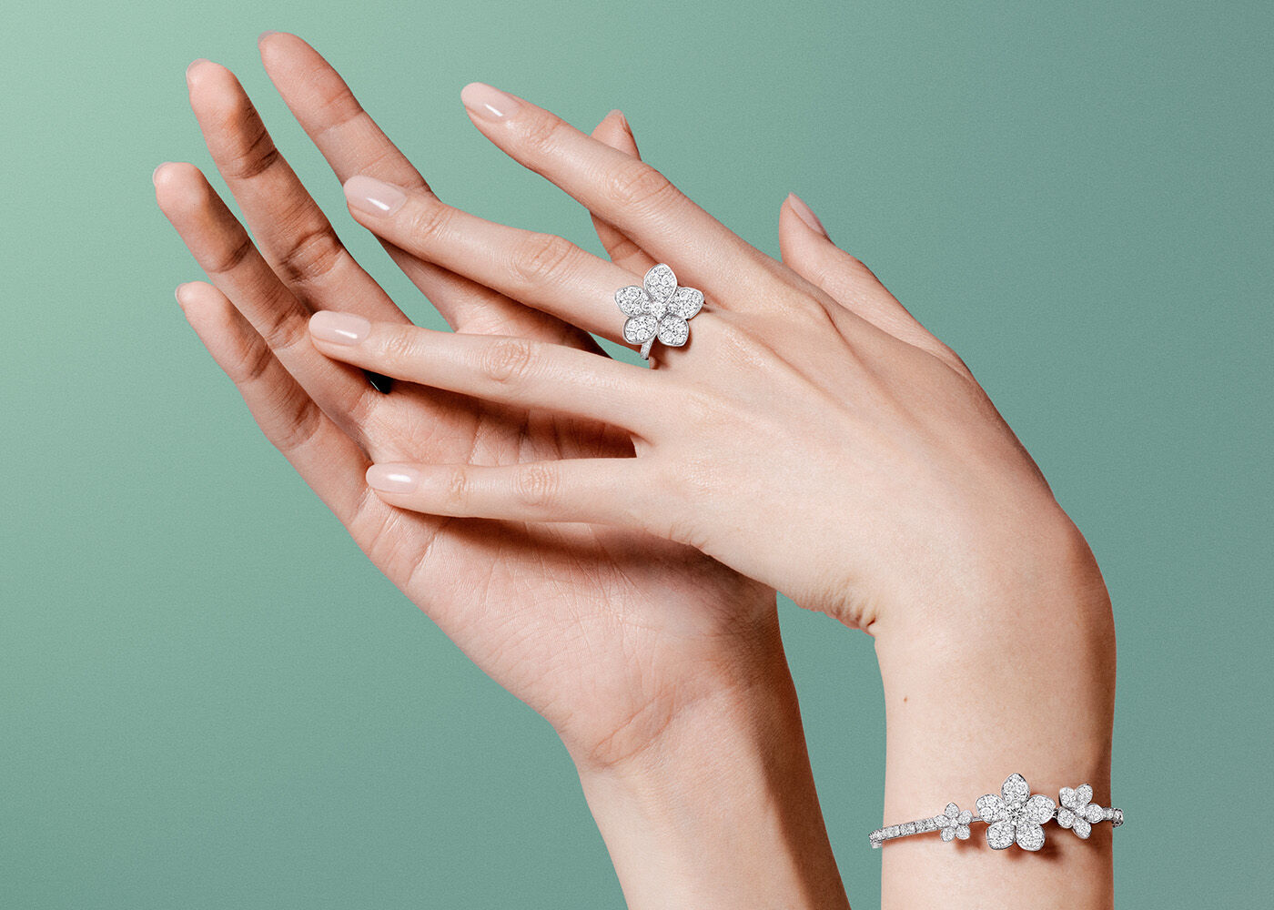Image model hands wearing Wild Flower ring and bracelet