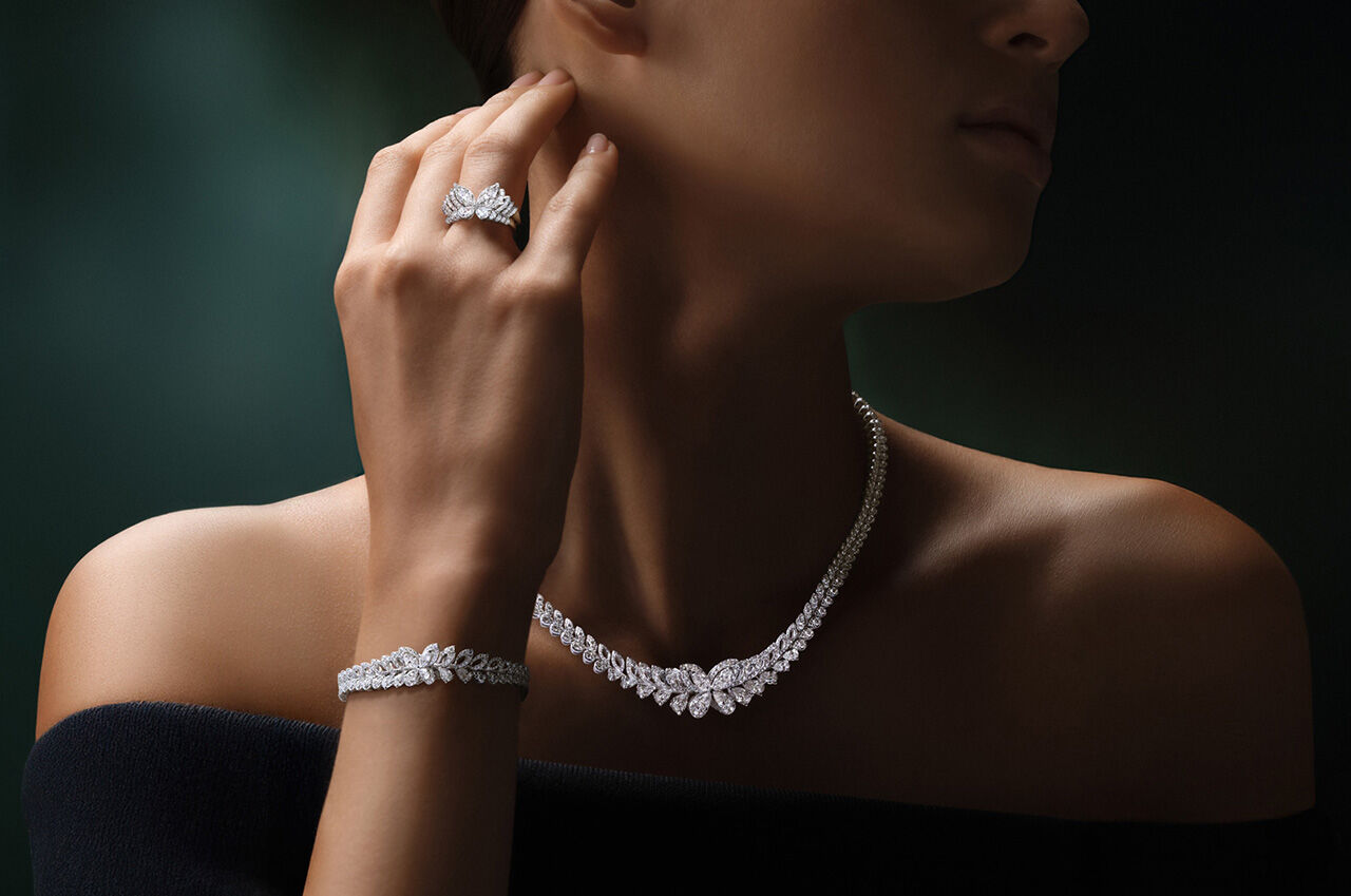 Image shows model wearing Graff Classic Butterfly Necklace, Ring and Bracelet 