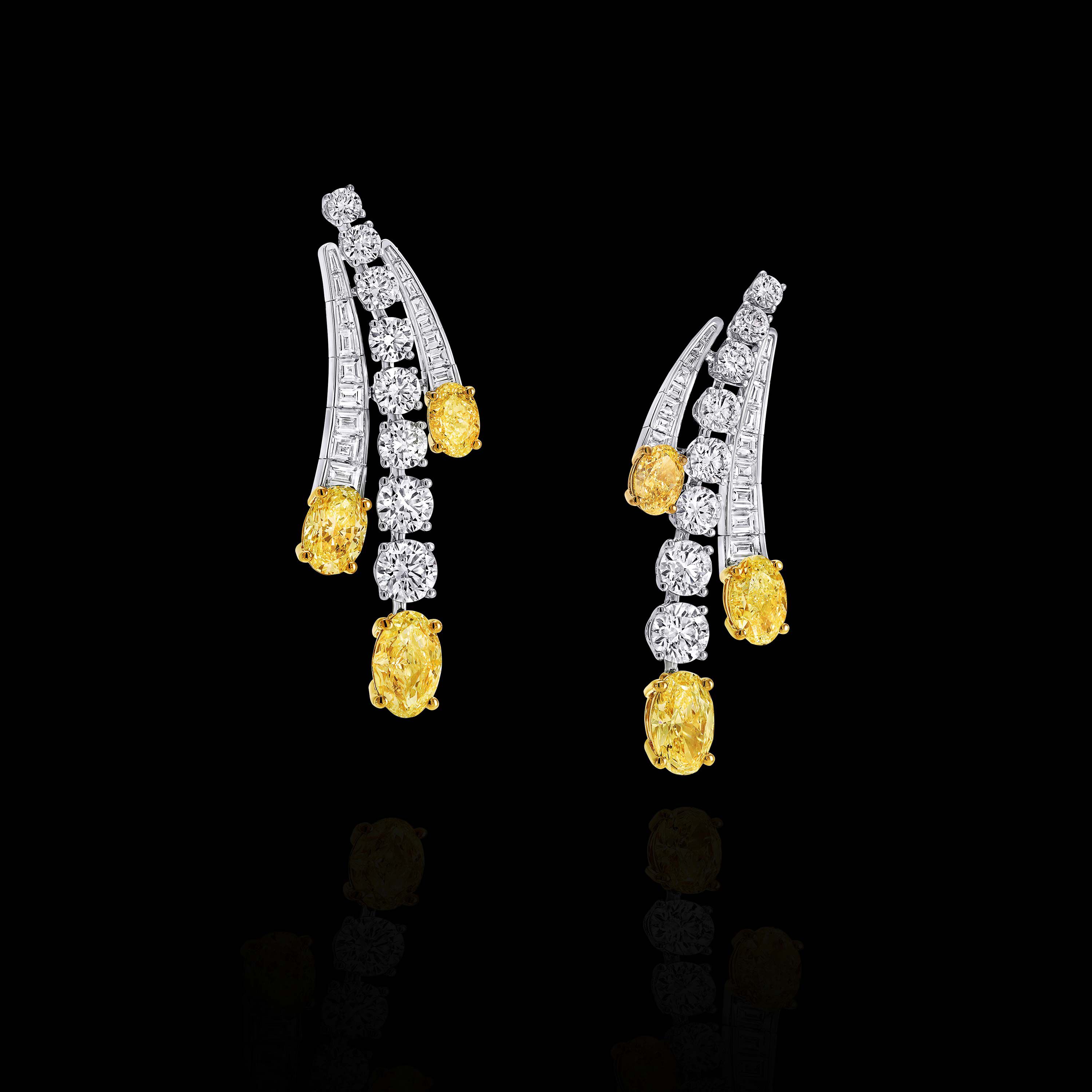 Image of model wearing Graff Galaxia Yellow Diamond Rings and Earrings