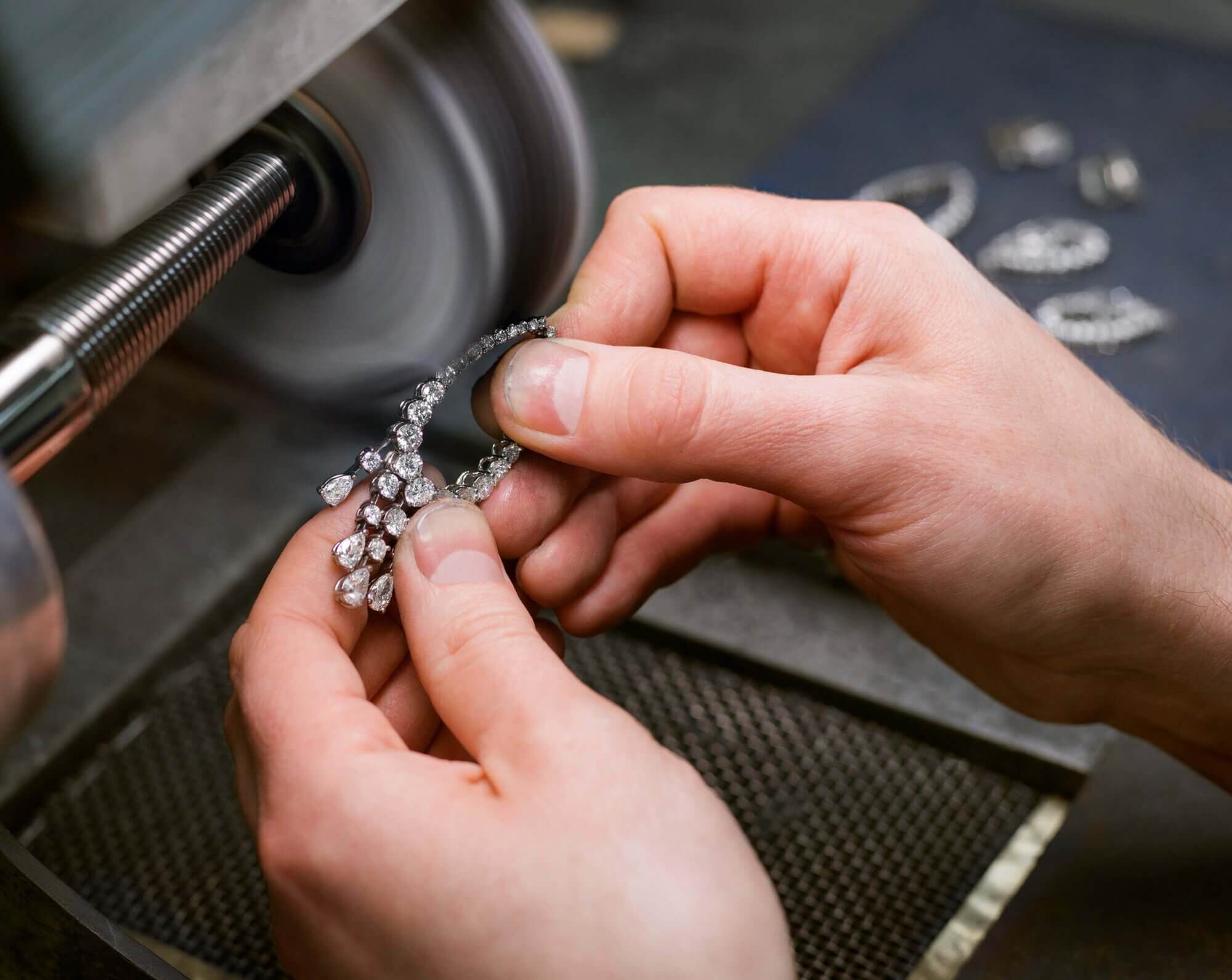 The final polishing on the earring setting using a series of different compounds