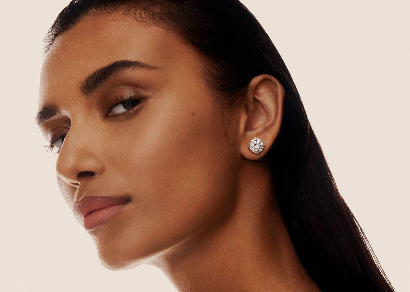 Model wearing a Graff diamond stud earring