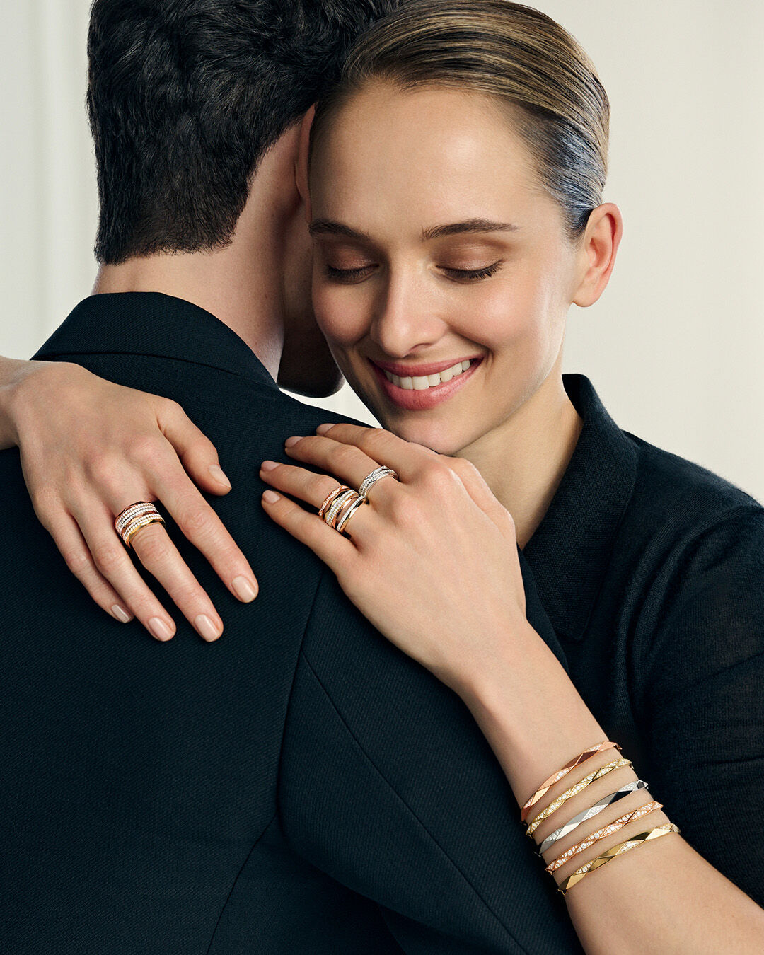 Image shows model wearing Laurence Graff Signature bangles and rings 