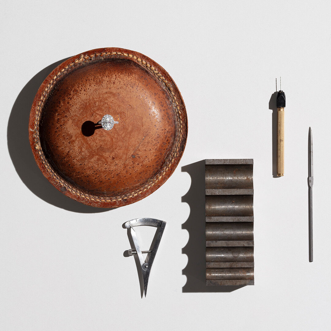 A guide to Diamond Colour - image shows Graff diamond engagement ring and workshop tools