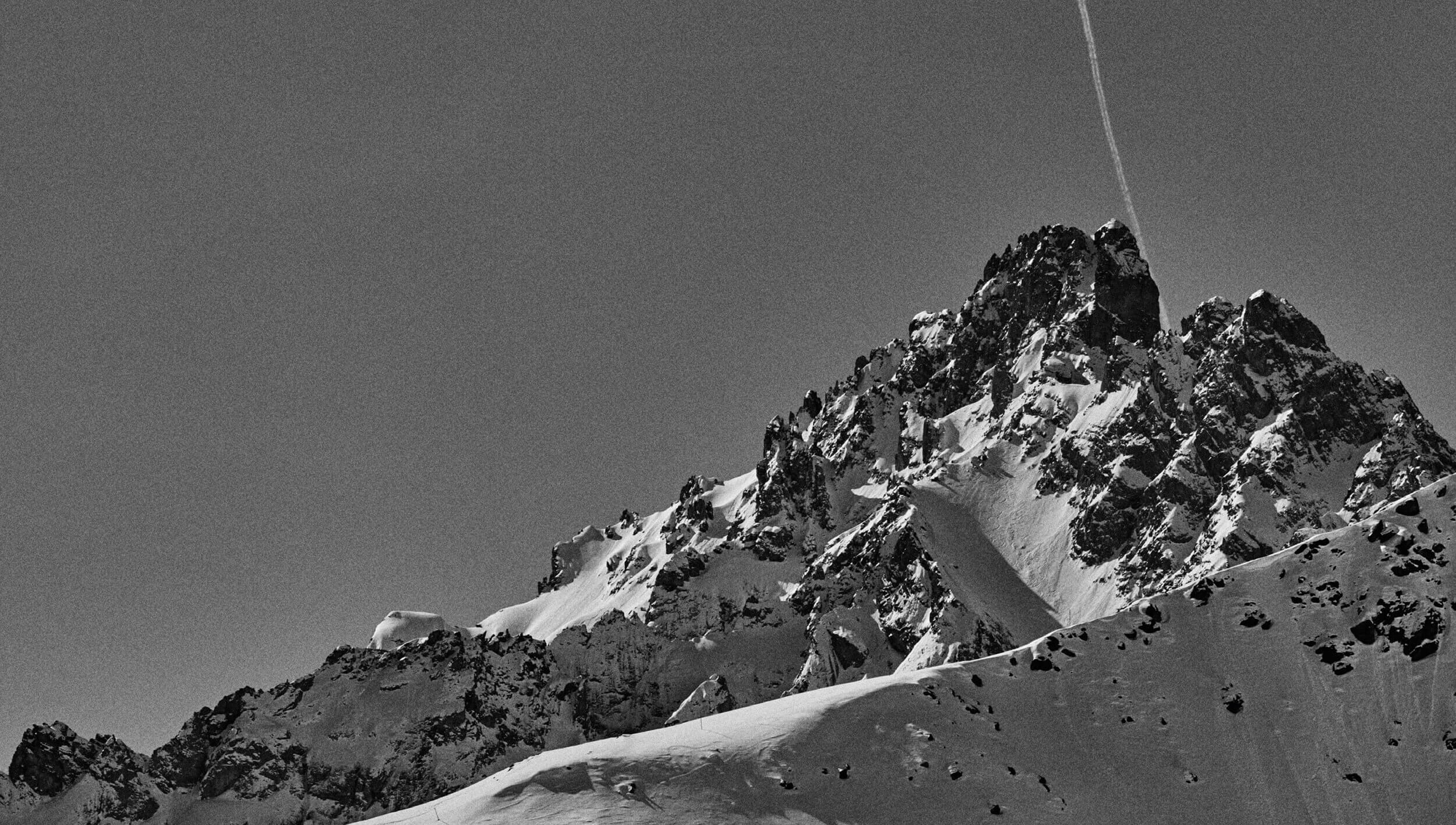 A photograph of an alpine mountain peak