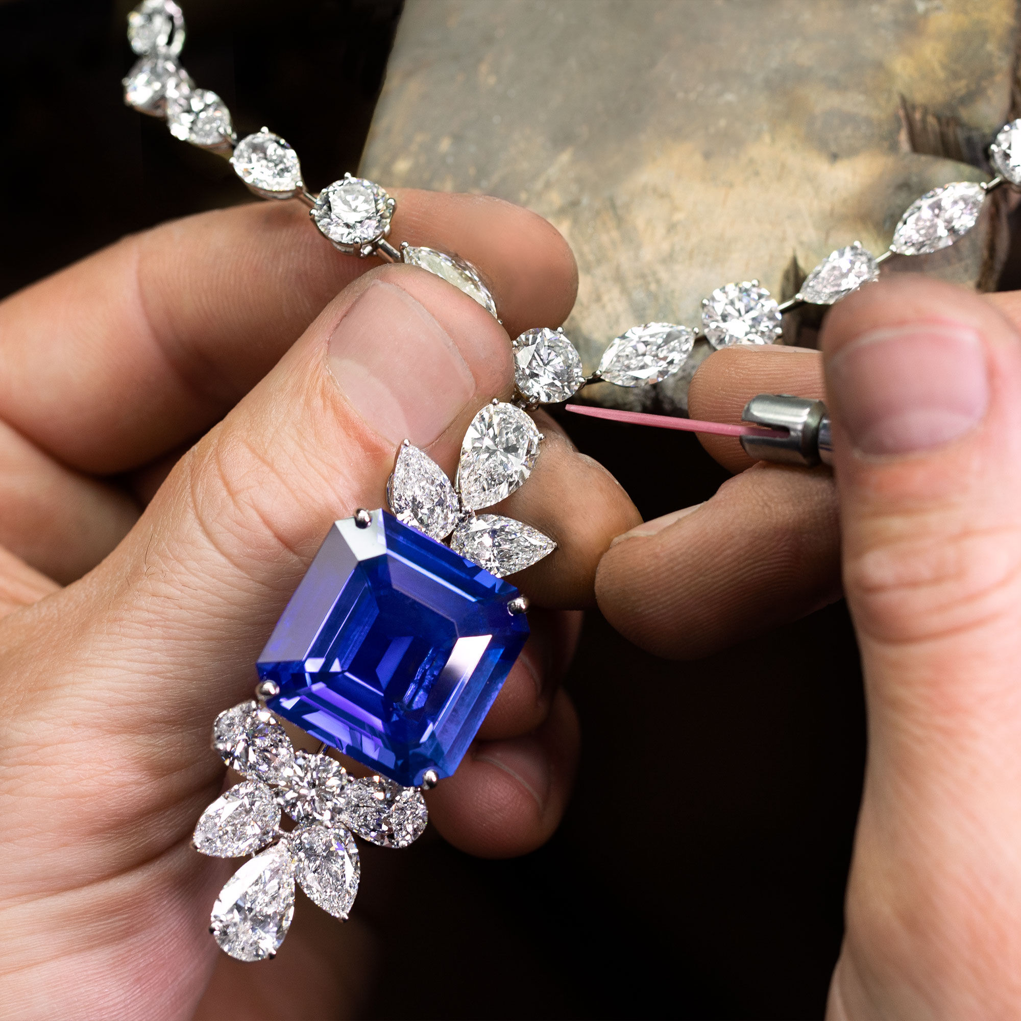 A Graff craftsman finalising a sapphire and diamond necklace in the workshop 