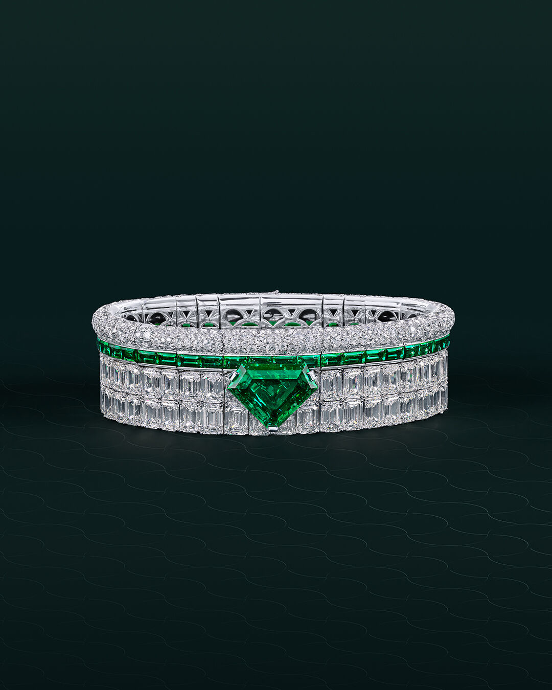 Image shows Graff Emerald and White Diamond High Jewellery bangle
