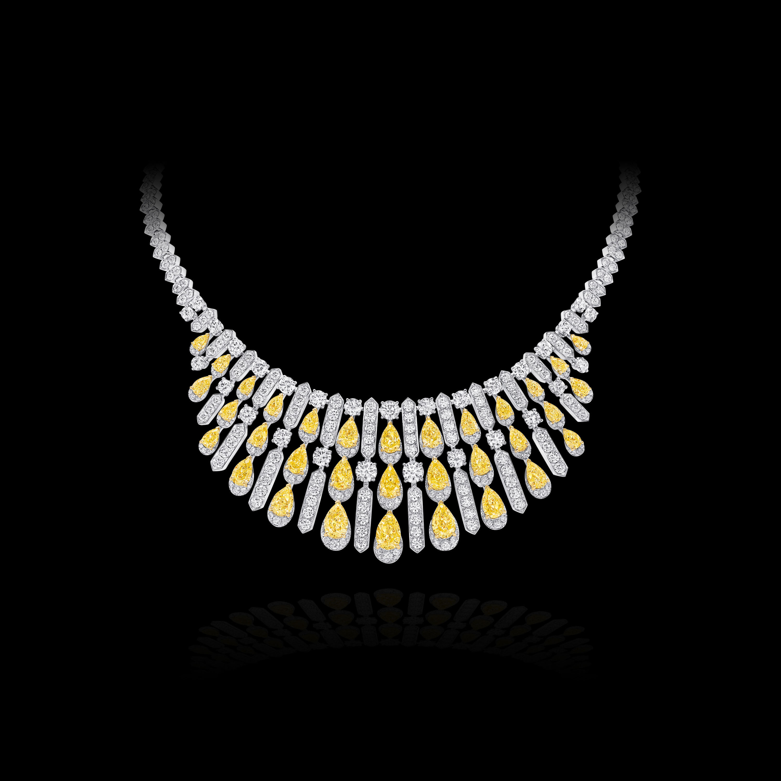 Image of model wearing Graff Galaxia Yellow Diamond Rings and Earrings