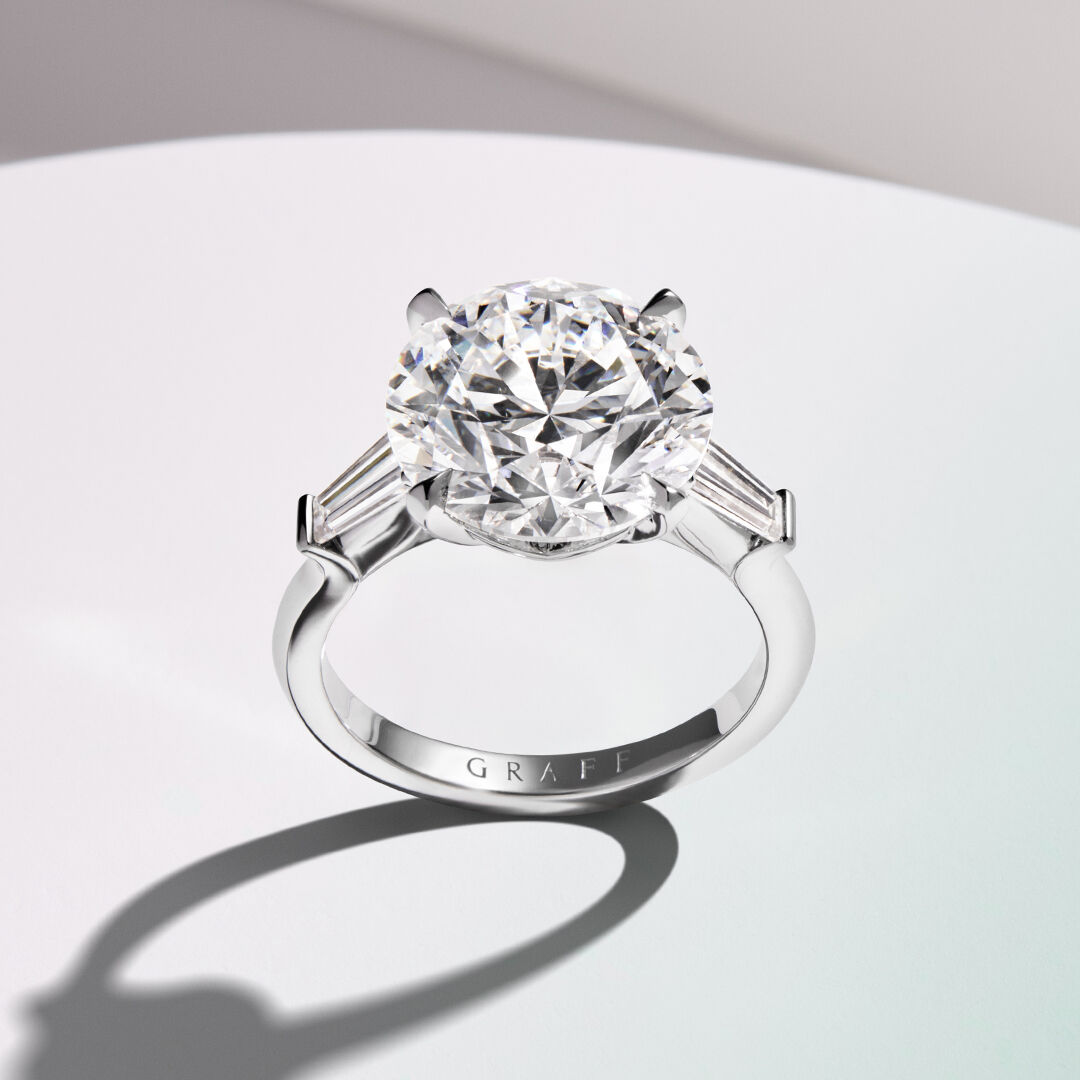 Image of model hands wearing Graff Tilda's Bow ring and bracelets