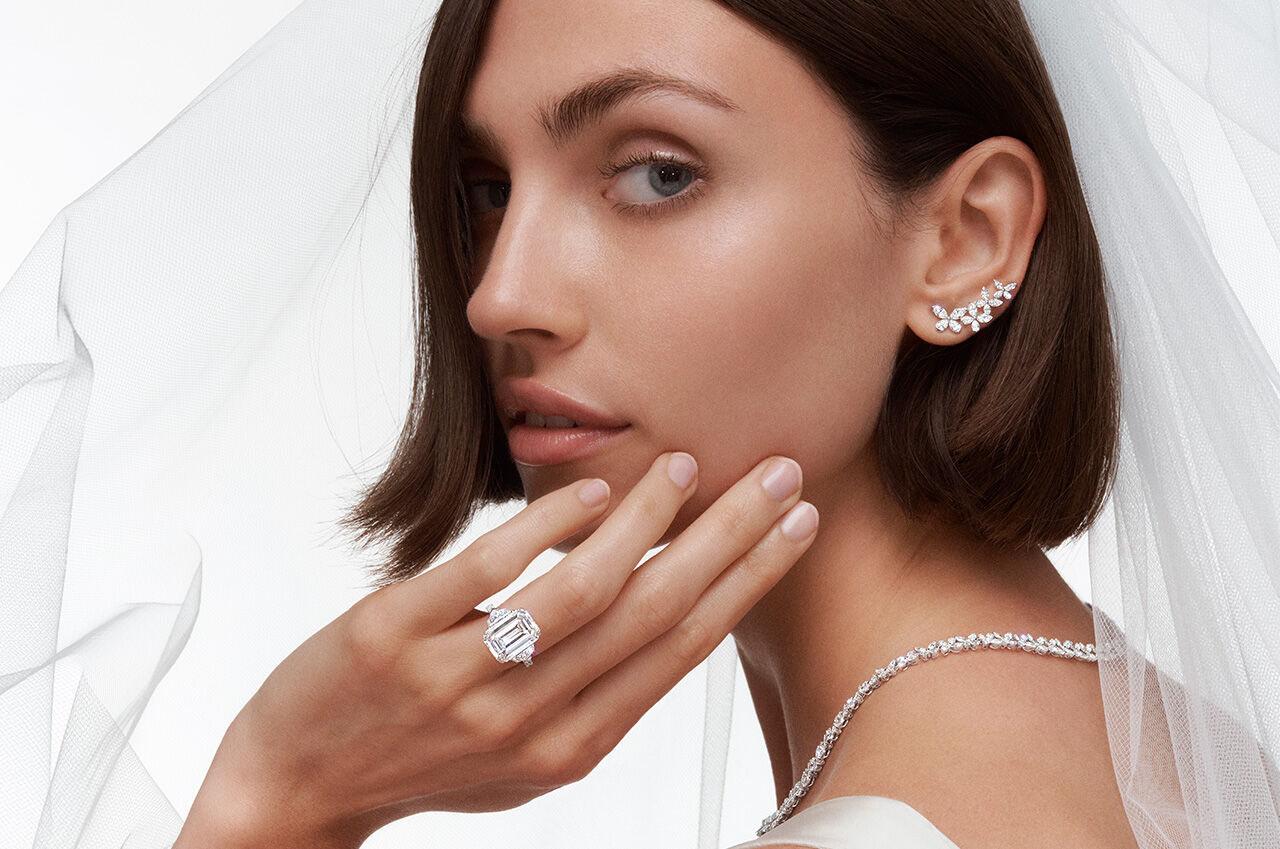 Model wears Graff Promise Emerald Cut Engagement Ring