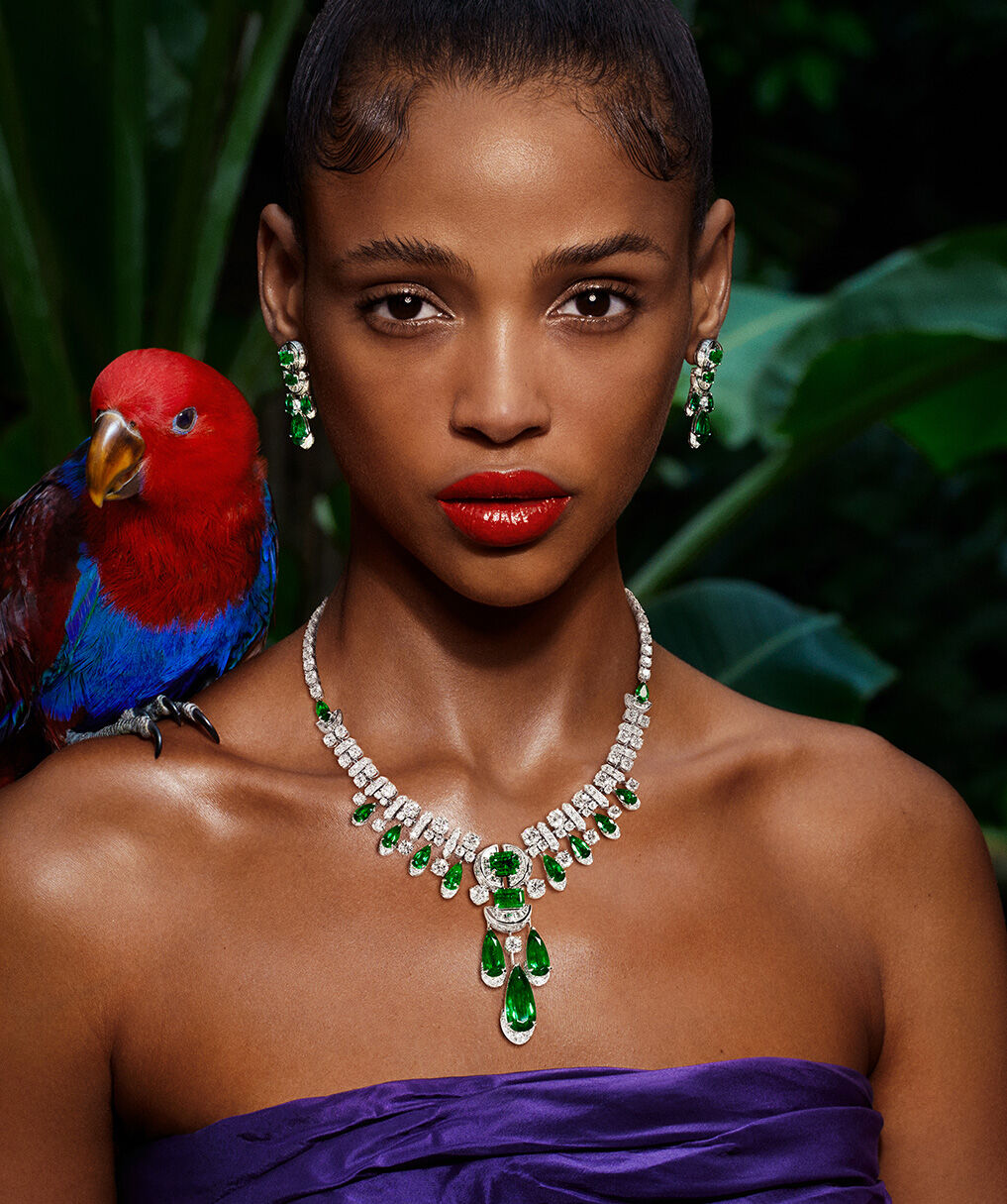 Model wearing Graff Emerald and white diamond necklace and earrings 