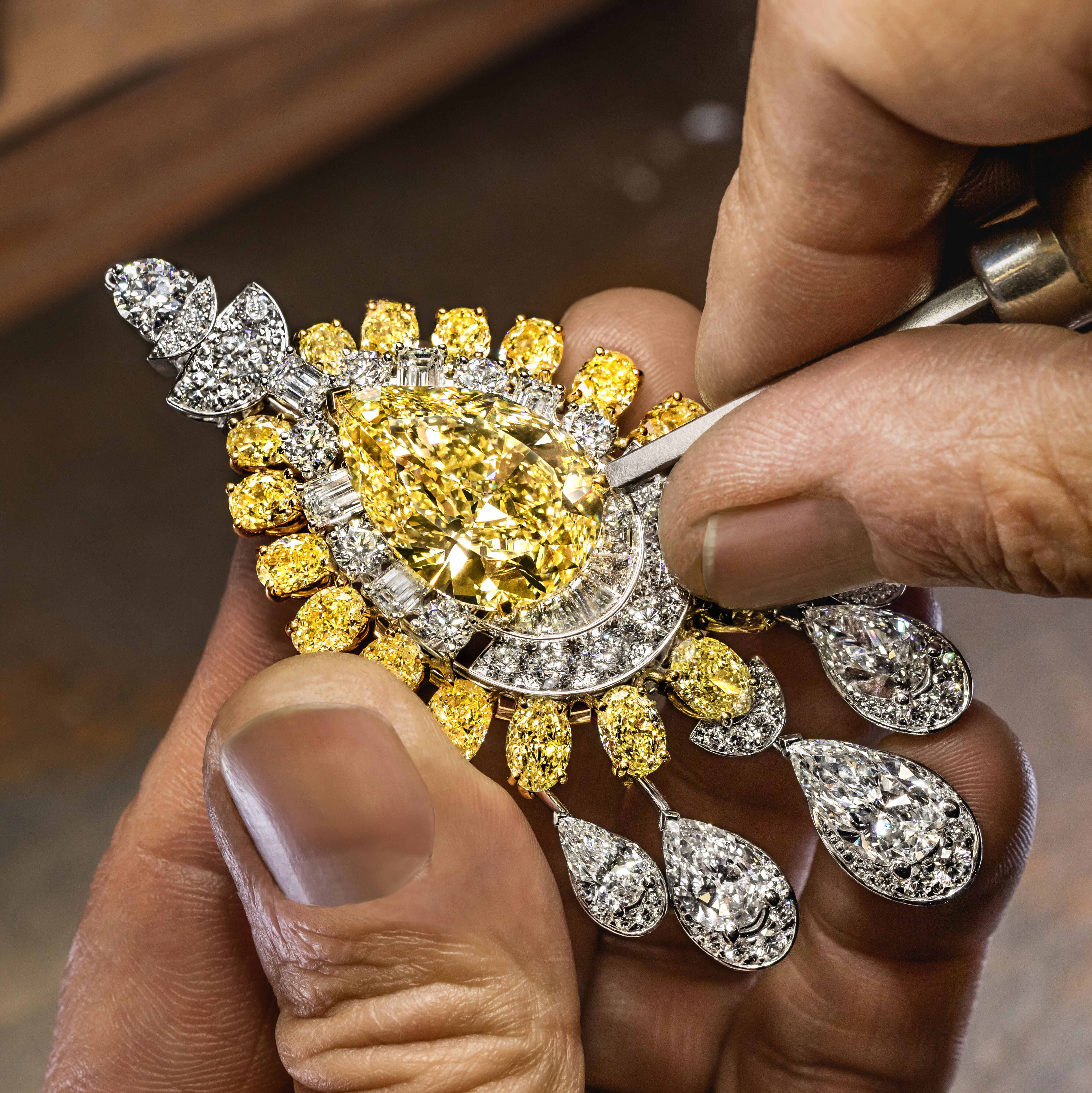 Image of Graff craftsman creating Graff yellow diamond high jewellery necklace in London workshop