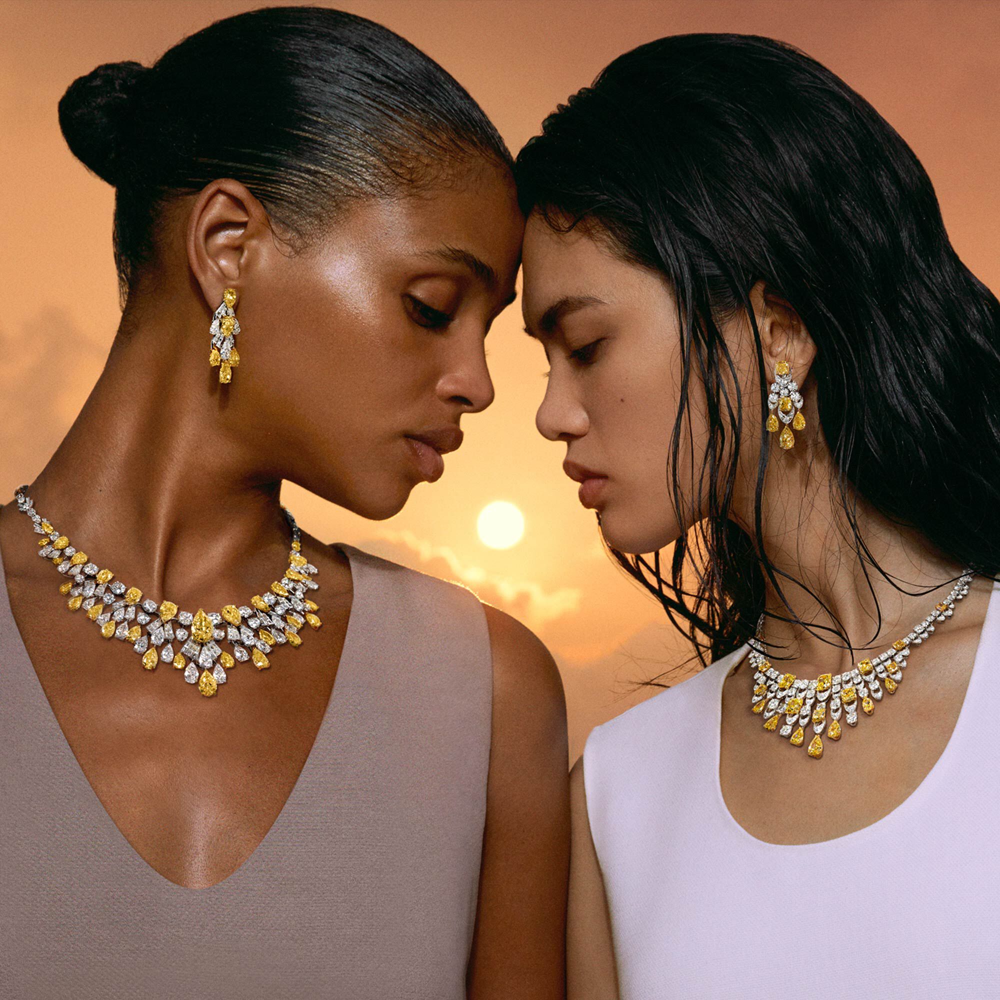 Models wearing yellow and diamond high jewellery suits